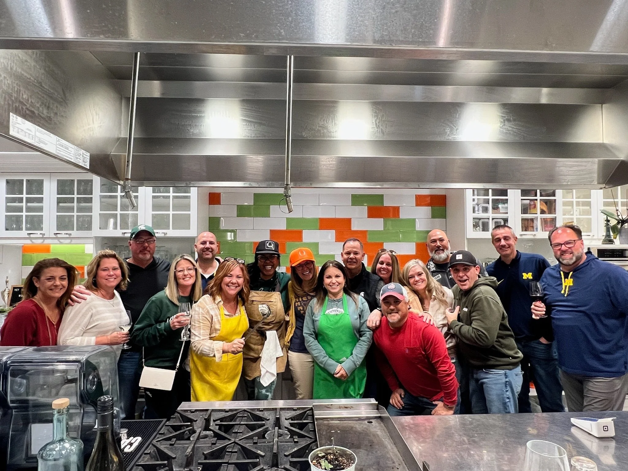 Corporate group attending an Out of the Office team event at The Kitchen by Cooking with Que