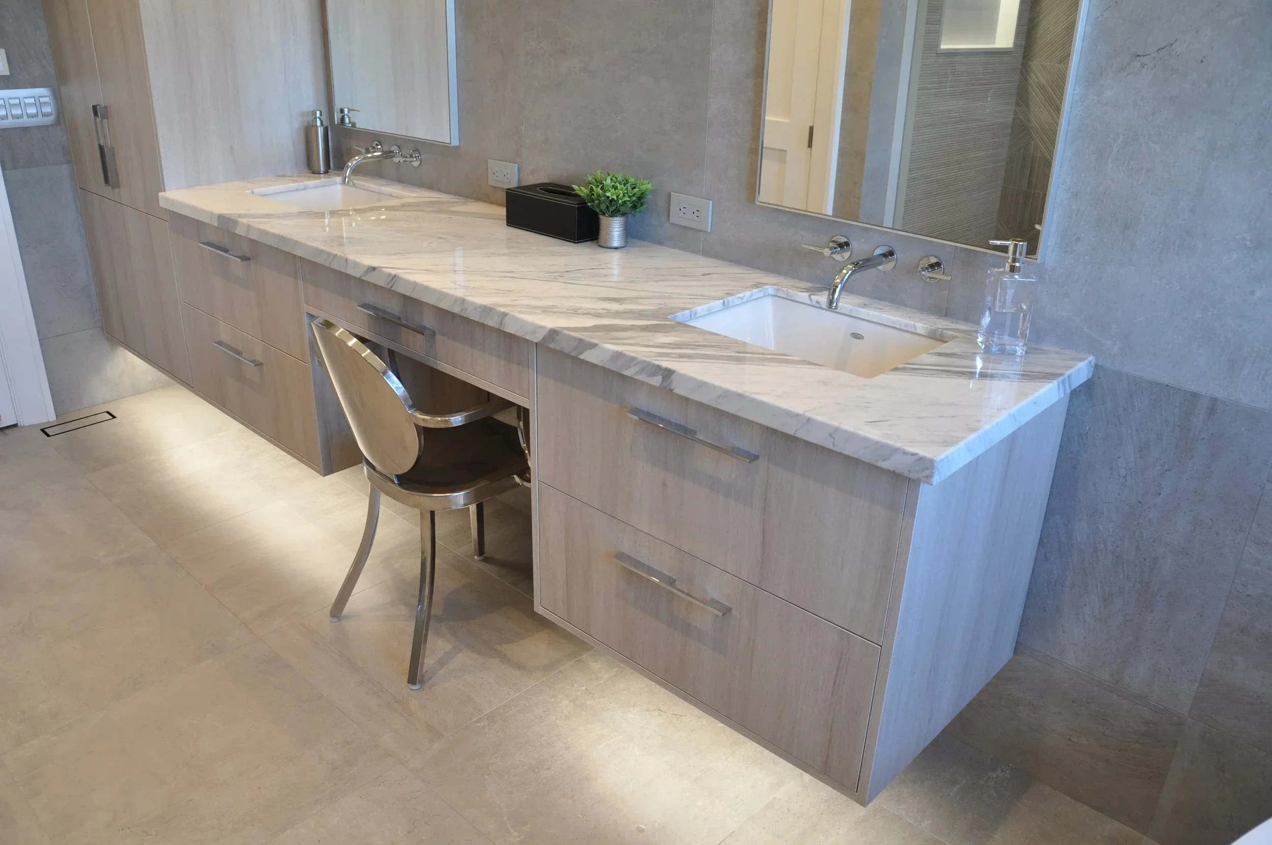 Double vanity with marble countertop and custom cabinetry, built by Diamond Custom Homes.