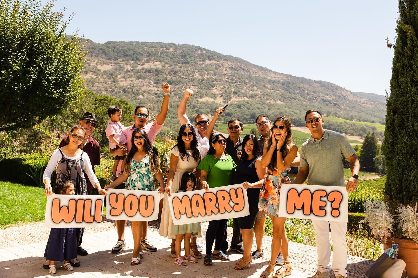 He had each of her nieces and nephew walk out one at a time with a sign, and then he pulled out &ldquo;me?&rdquo; and went down on one knee- and then the celebration began! Congrats, you two! And big thanks to @napa_valley_proposals for all the plann