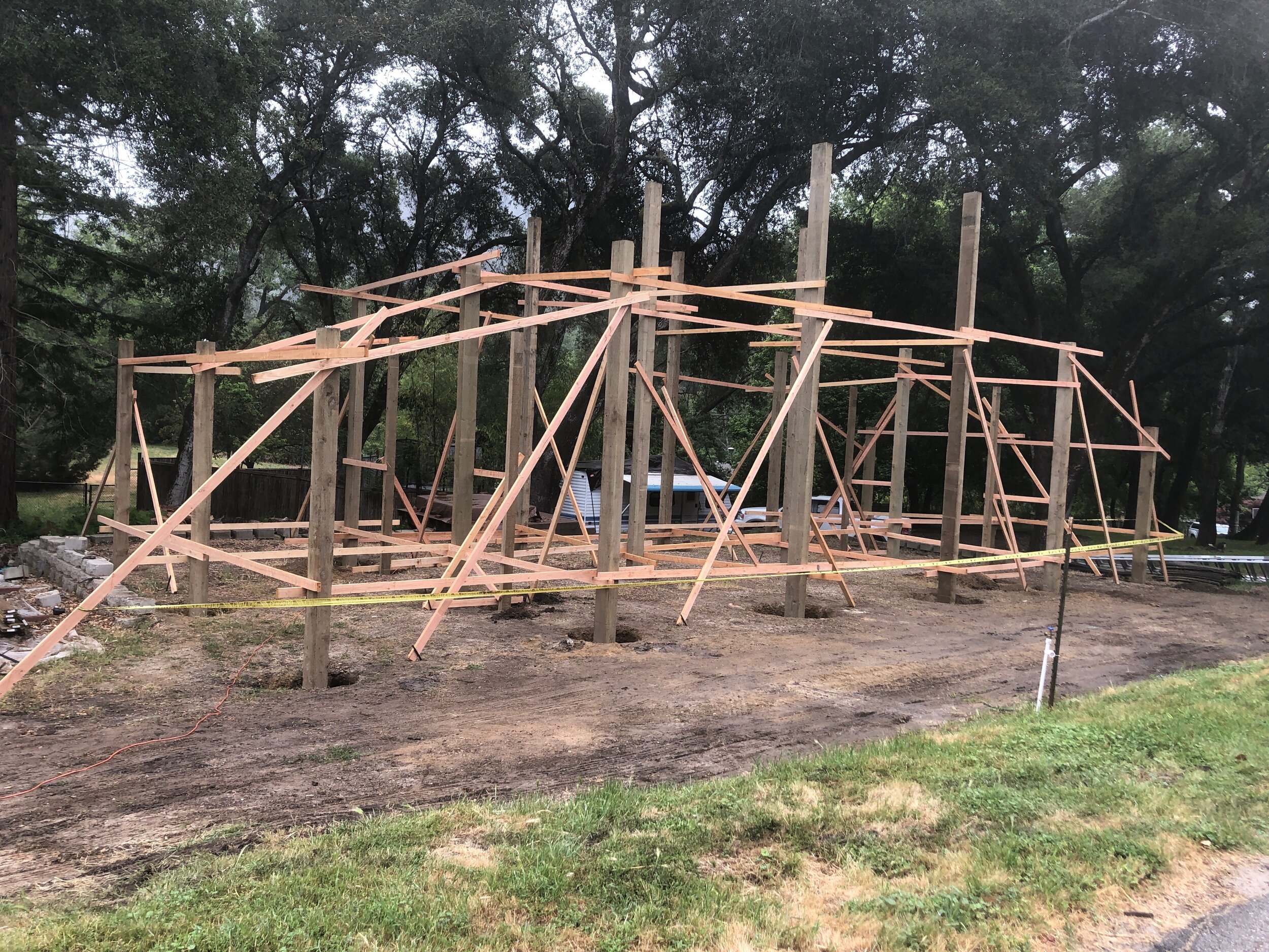 Took 2 1/2 8 hour days to set the posts and check to make sure it was plumb and square. We're now ready for the posts & sidewalls concrete.