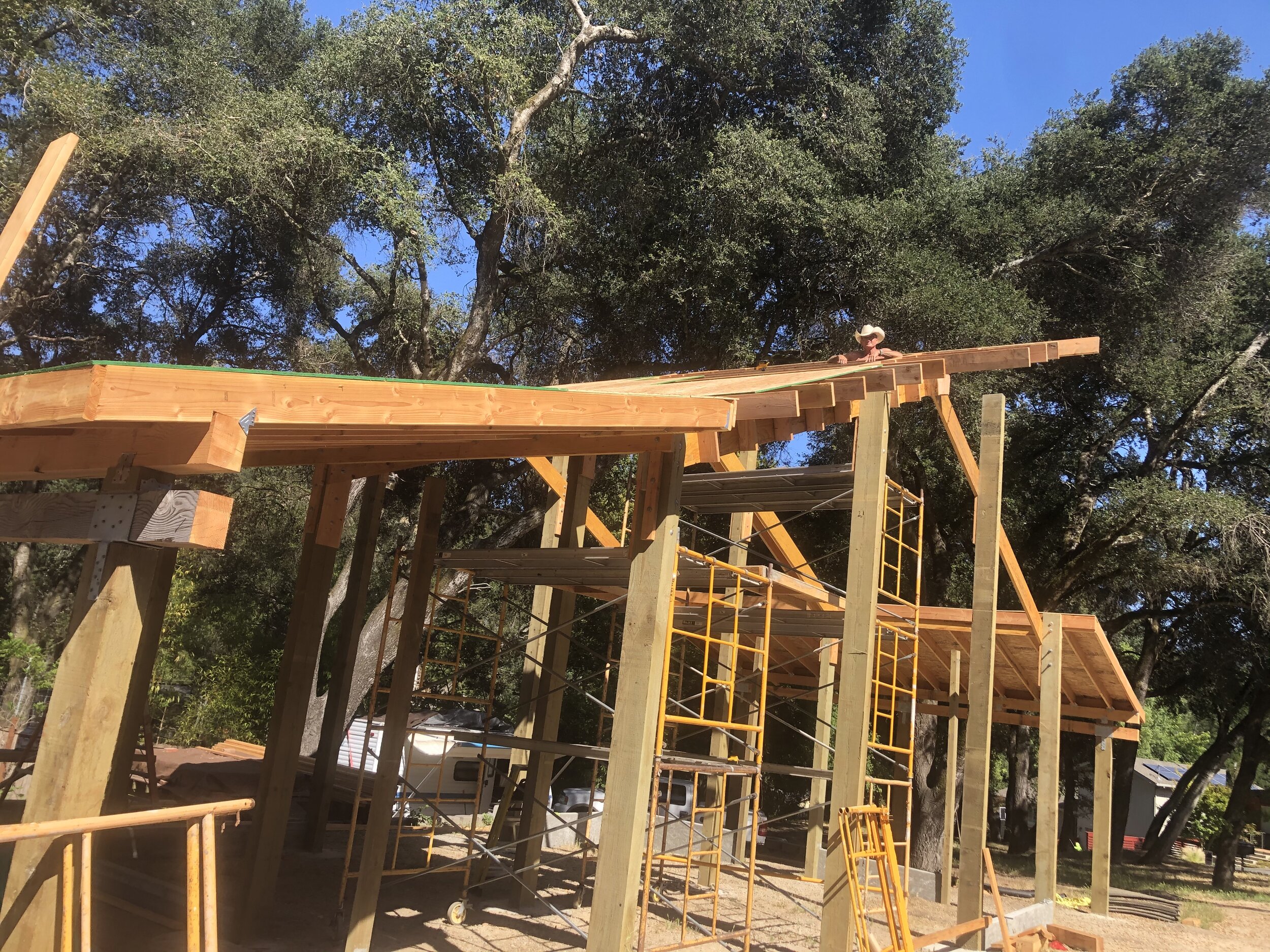 Adding the sheathing as he goes.
