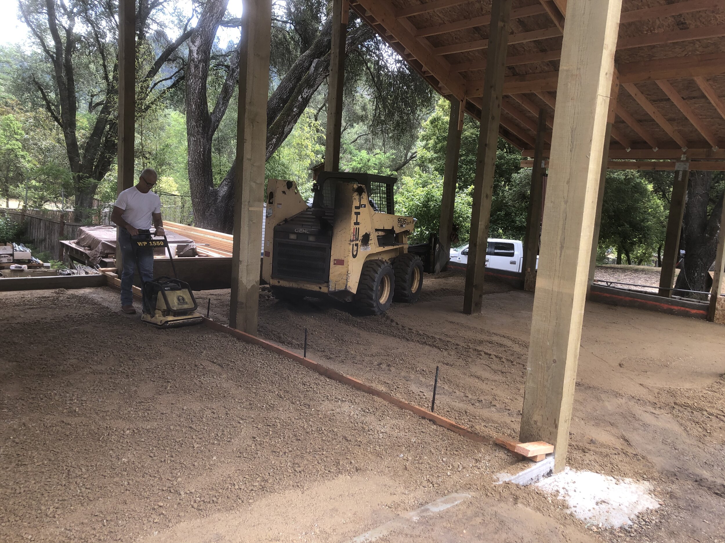 Fixing the grade inside. First the base rock.