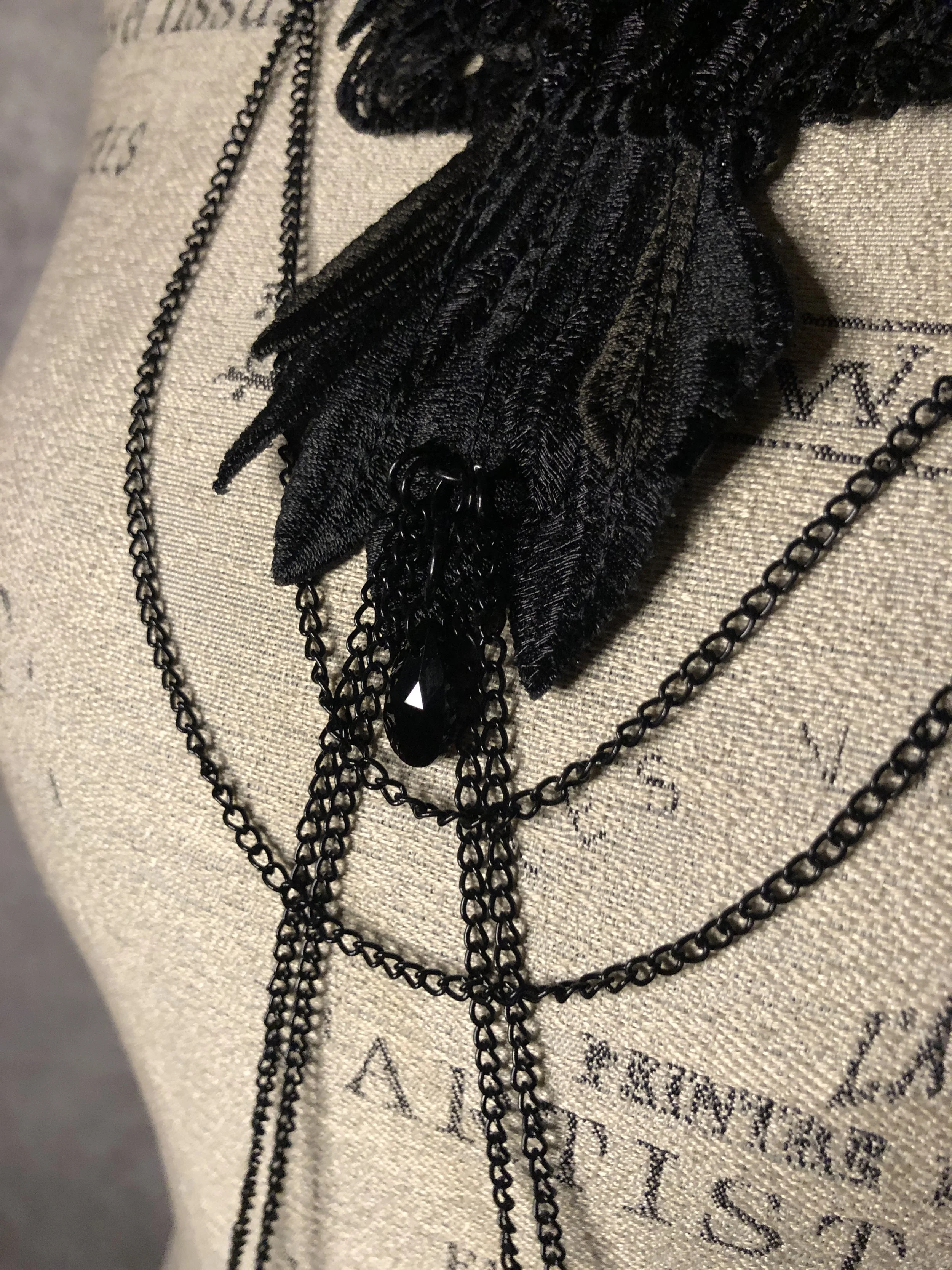 The Poe body chain harness embroidered flying raven, black chains and