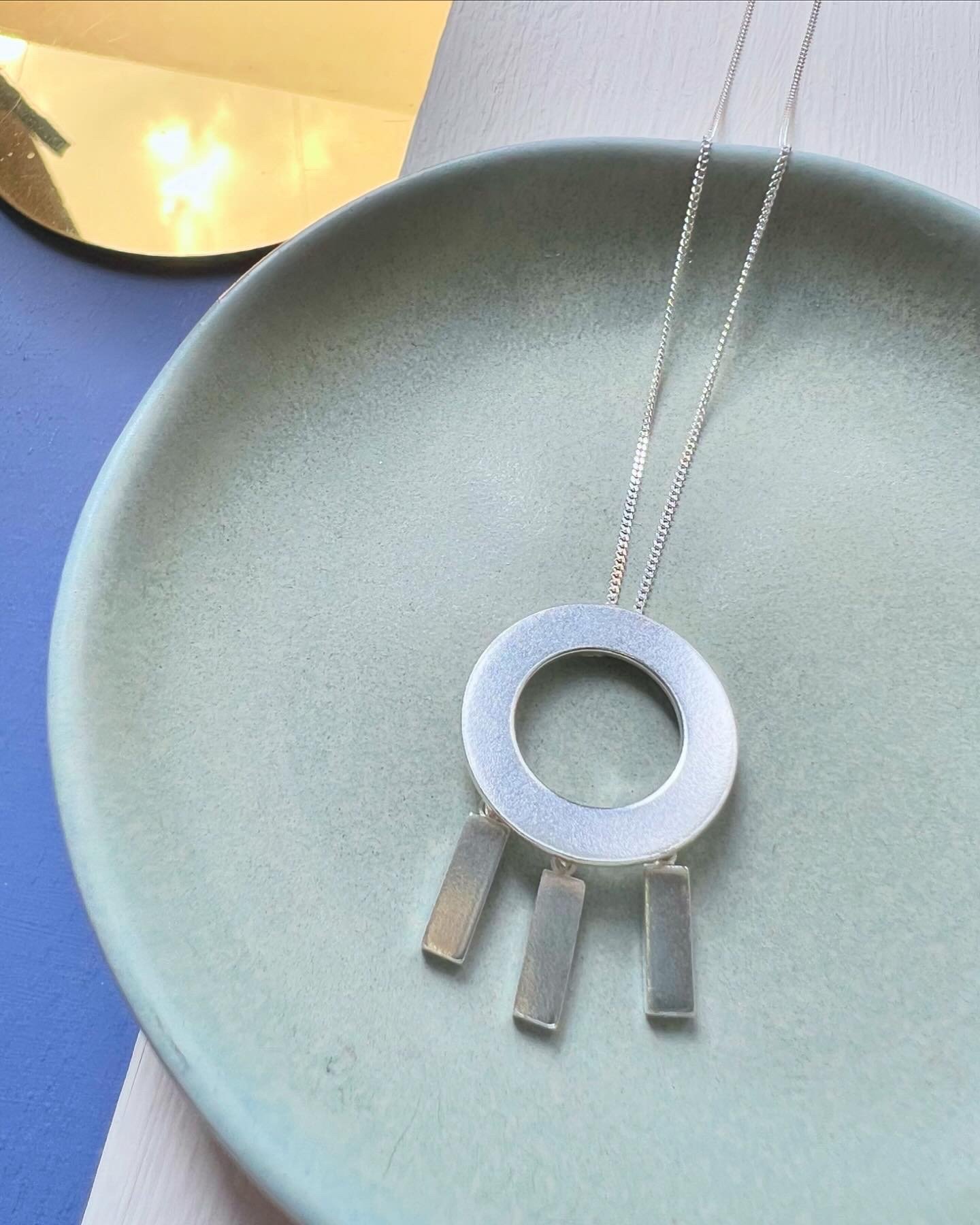 Sun Ray silver statement pendant.jpeg