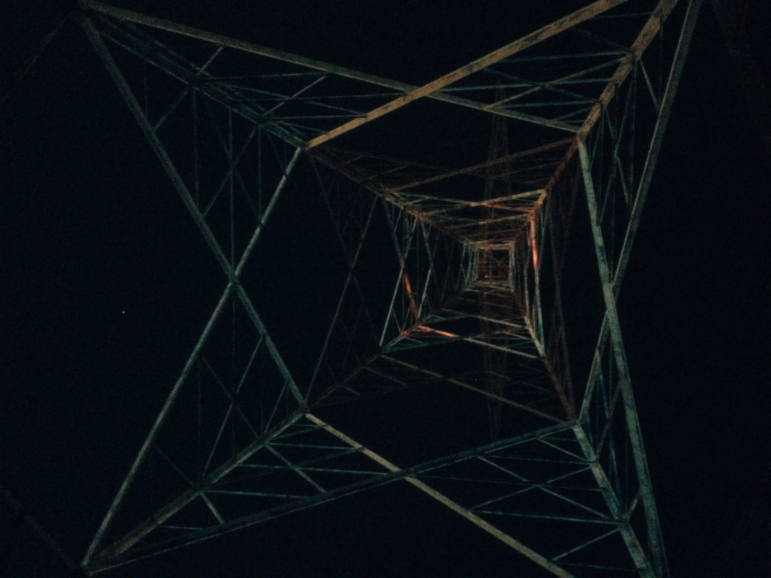 High Tension tower from underneath at night.png