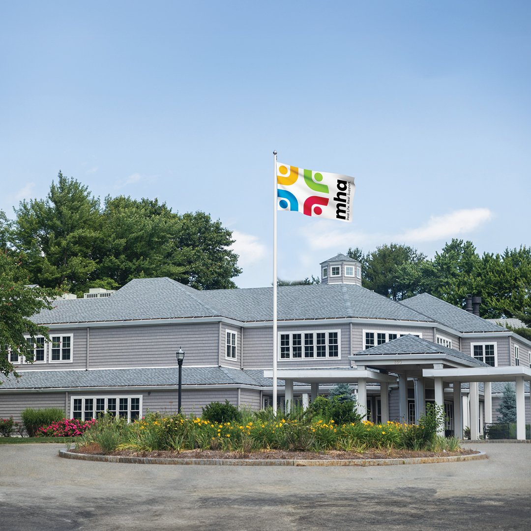 white mha flag waving in front of corporate headquarters