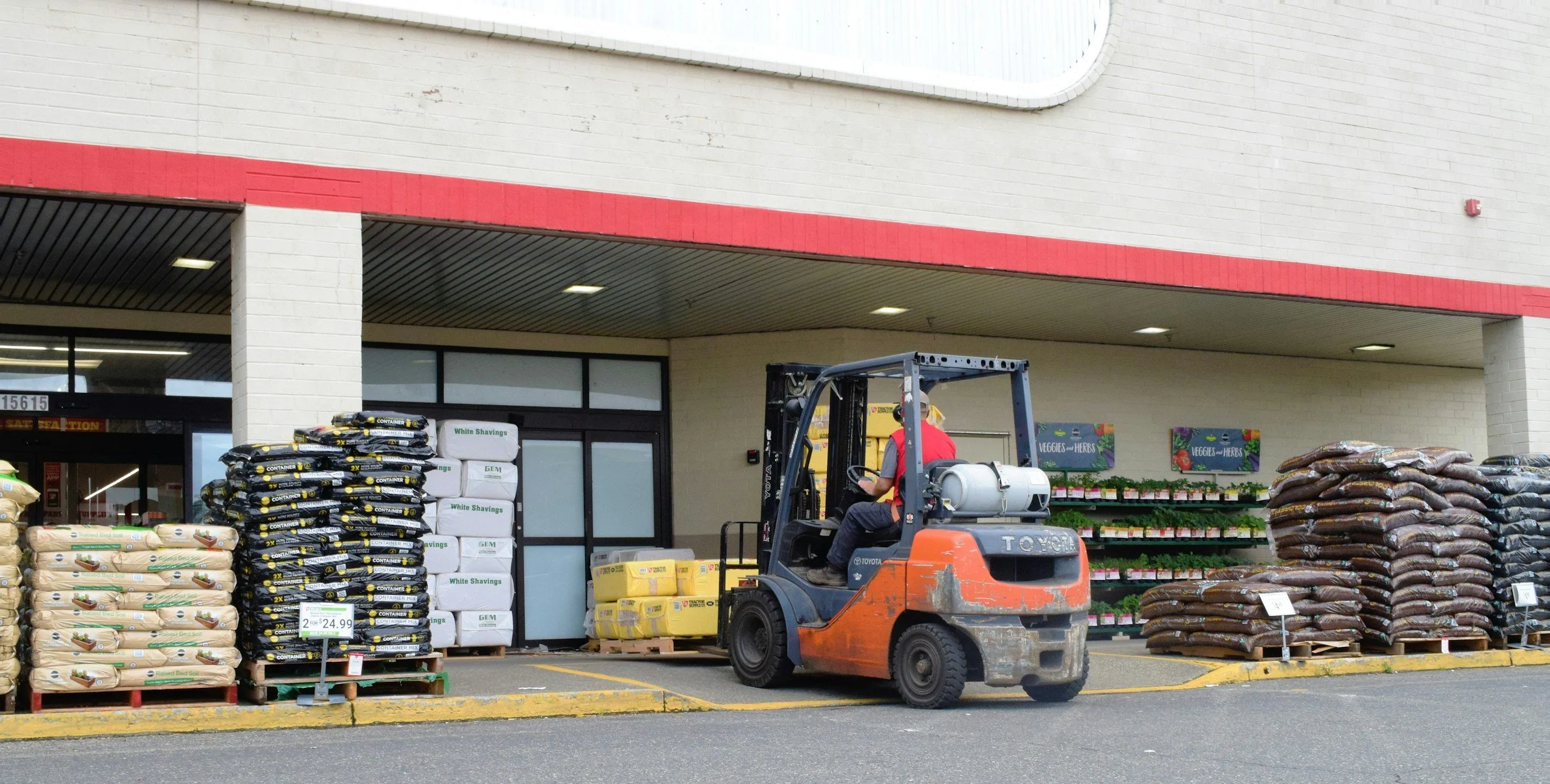 Worker driving a forklift at work, highlighting a safety critical role