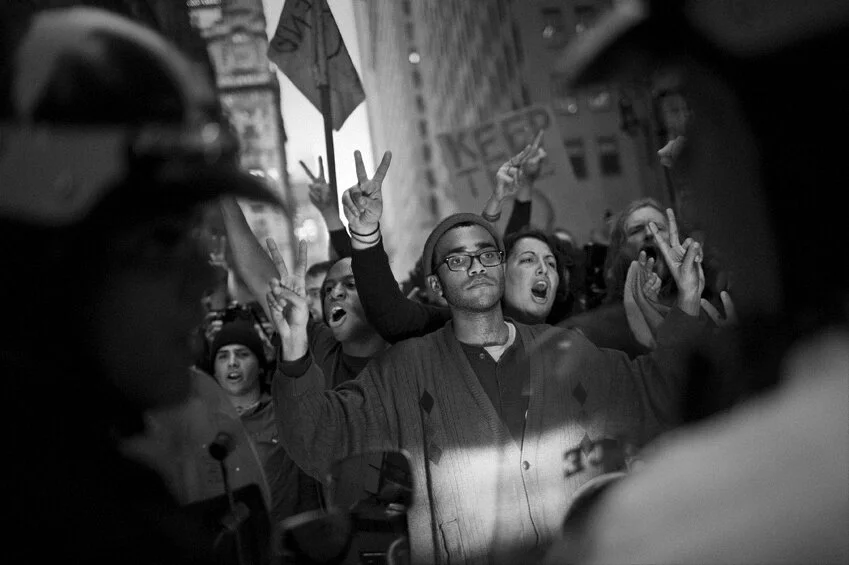 Occupy Wall Street protesters marching south on Broadway in NYC..