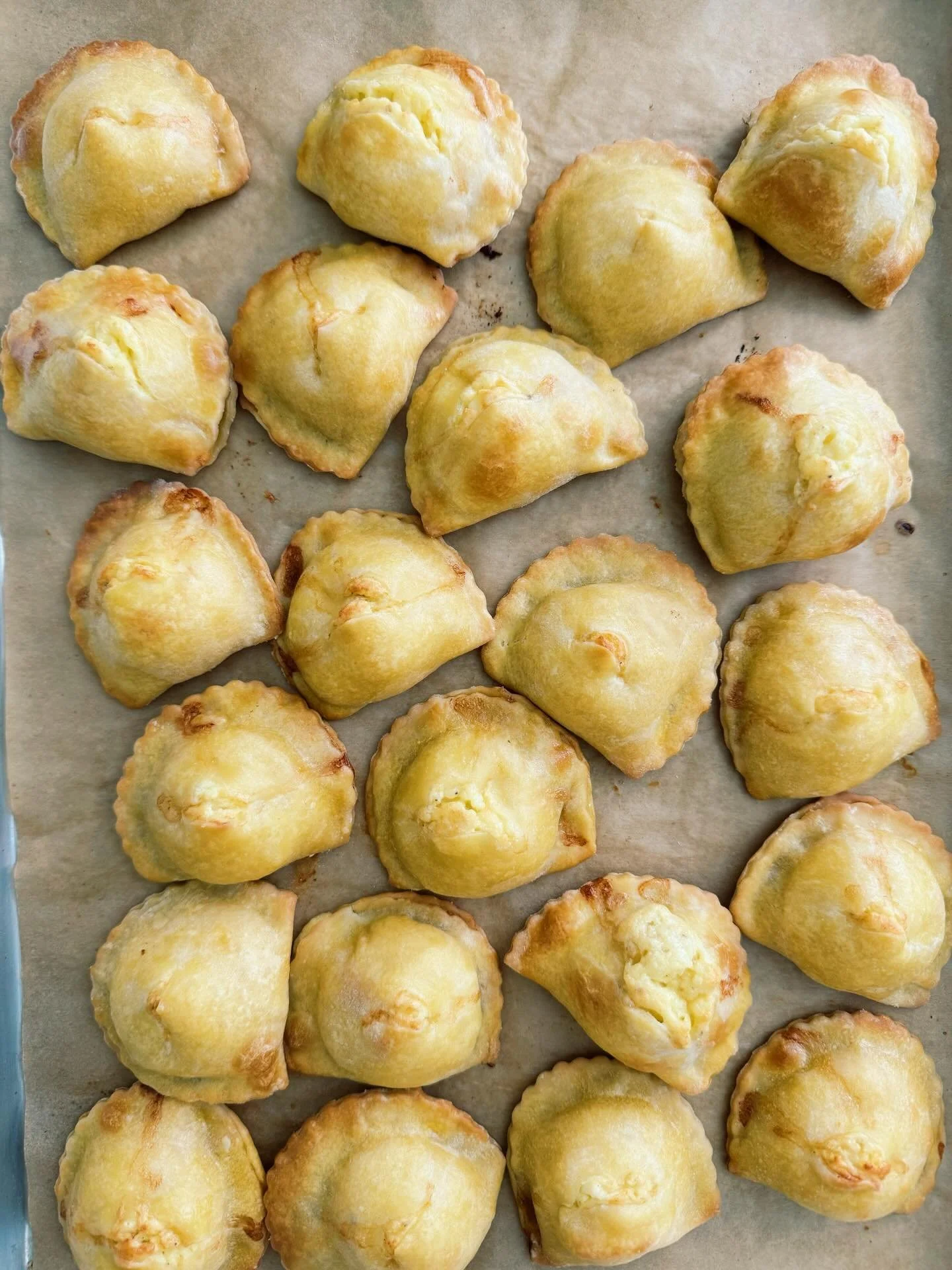 ✨FIADONI✨These savory cheese-filled pastries get their name for the way they puff up during baking (&ldquo;fiato&rdquo; means breath) and the way some of the cheesy filling spills out of a little snip cut into their tops. Fiadoni are traditionally se
