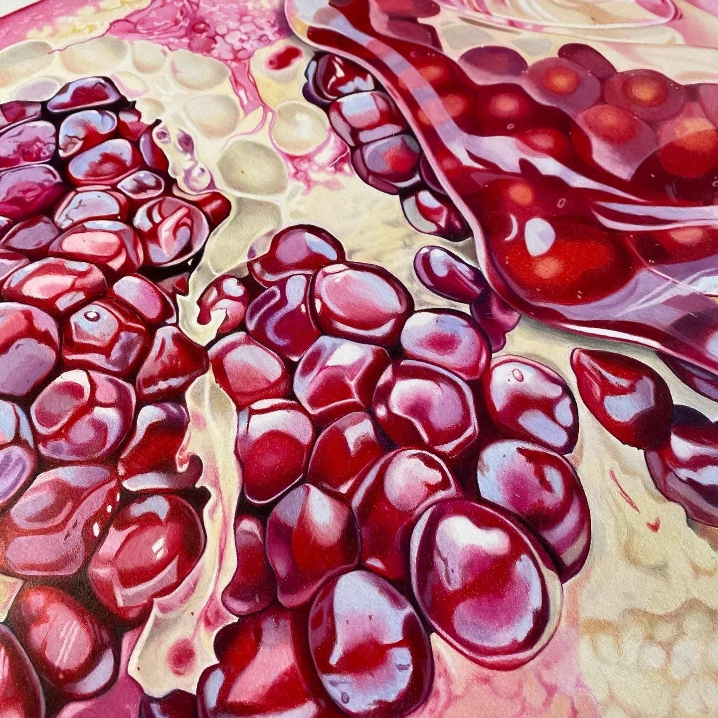 Close-up of red and purple pomegranate seeds and pulp.