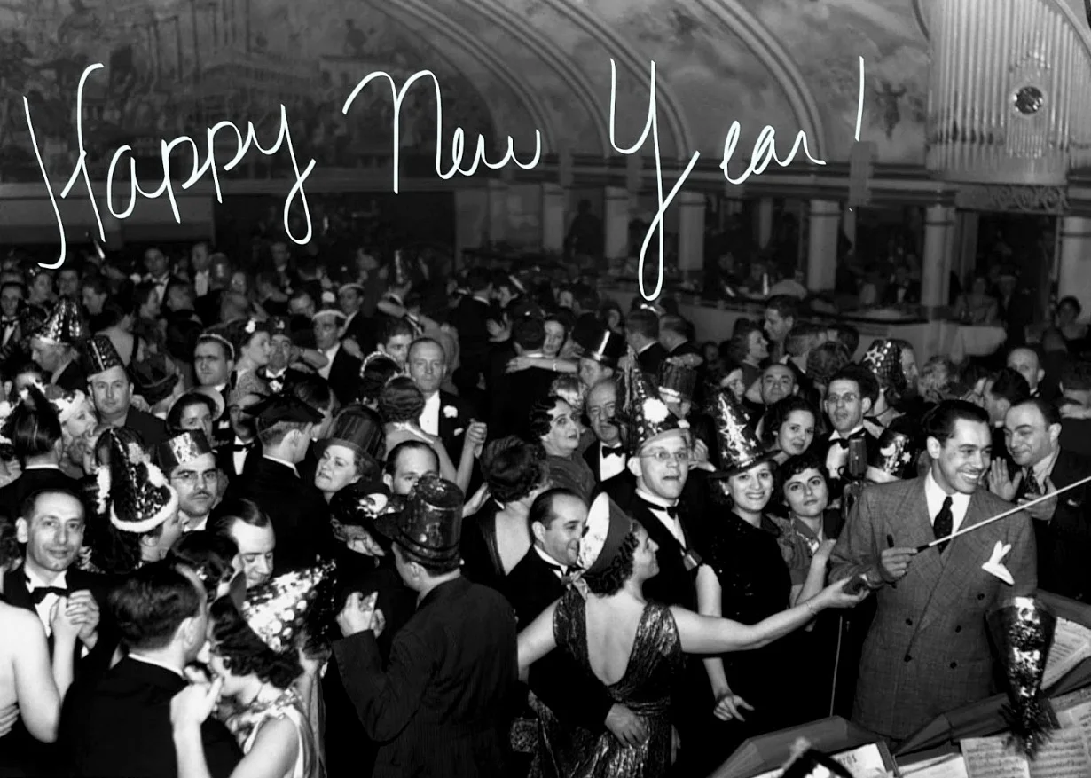 wehadfacesthen:

Happy New Year, Everybody! May it be a good one for all of us.This photo is, I believe, a celebration in New York with Cab Calloway leading the orchestra.