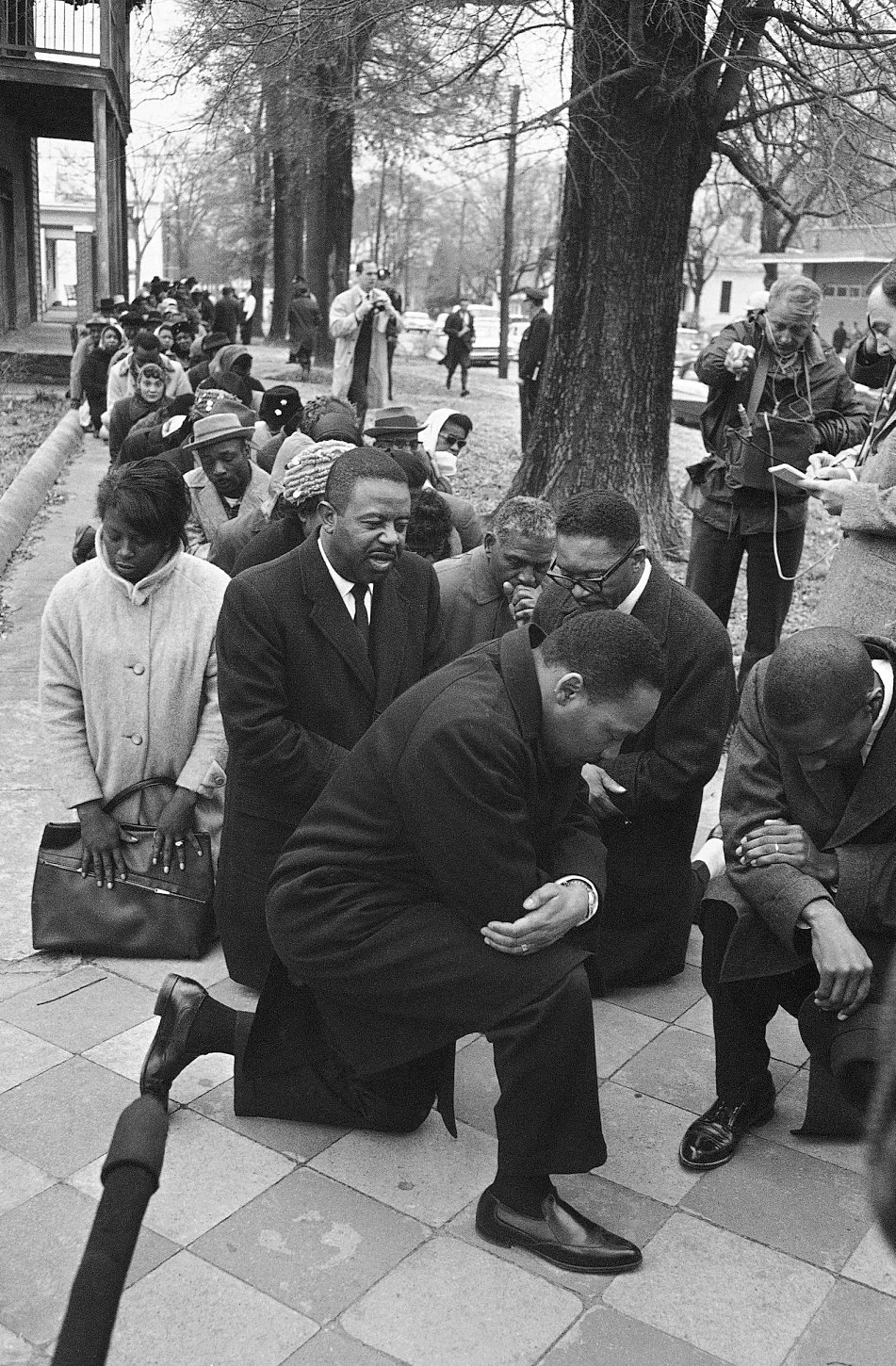 wehadfacesthen:

The Rev. Dr. Martin Luther King Jr leads a kneeling protest in Selma, Alabama, 1965