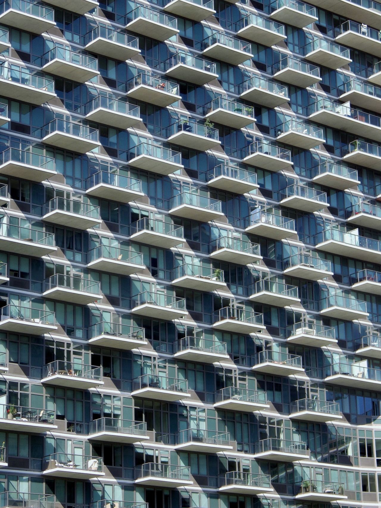 wanderingnewyork:

Balconies and windows in Hunters Point, Queens.