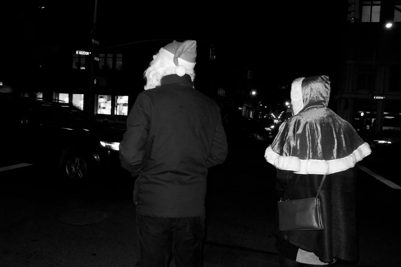Couple on Houston Street on Christmas Eve.