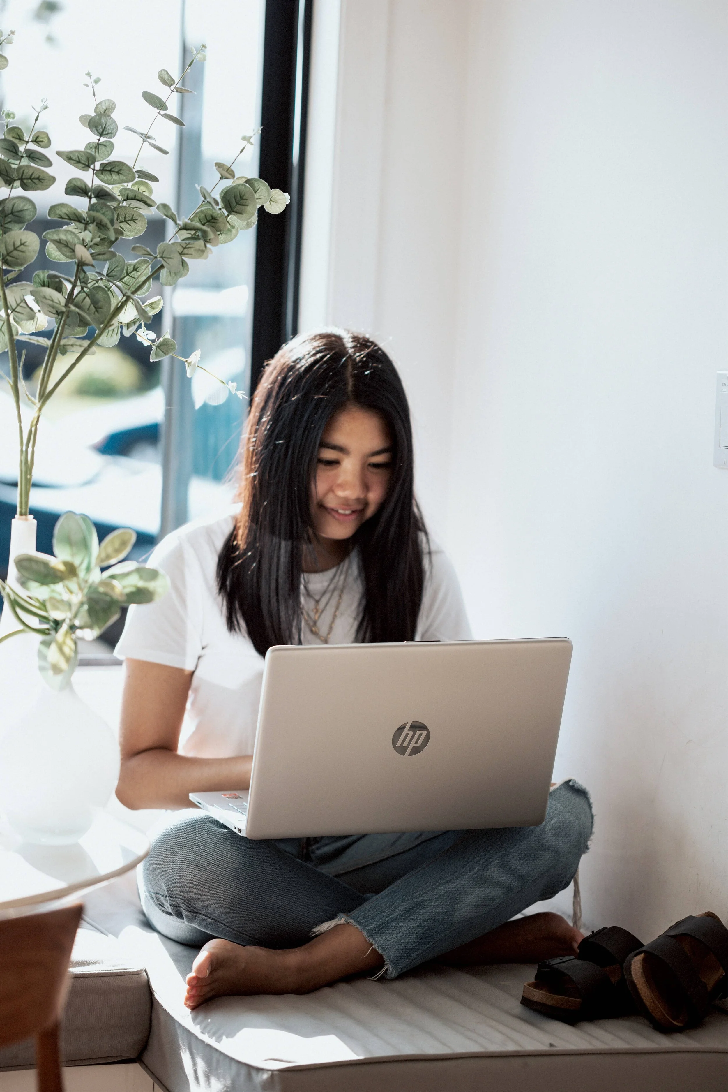 Girl working on her laptop and smiling.jpg