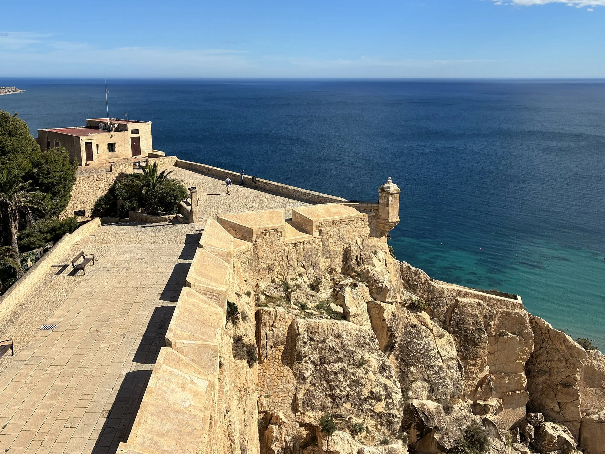 Panoramic vista from a castle in Alicante, Spain, showcasing the serene sea and hidden coastal beauty.