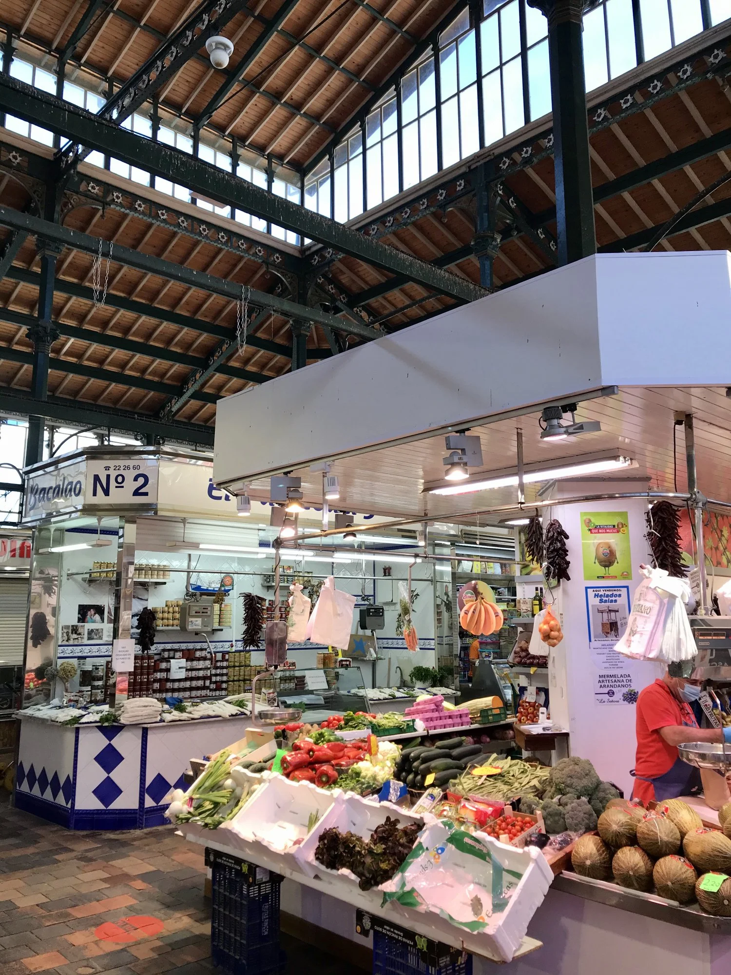 A vibrant market in Santander, Spain, filled with an abundance of fresh produce and colorful vegetables.
