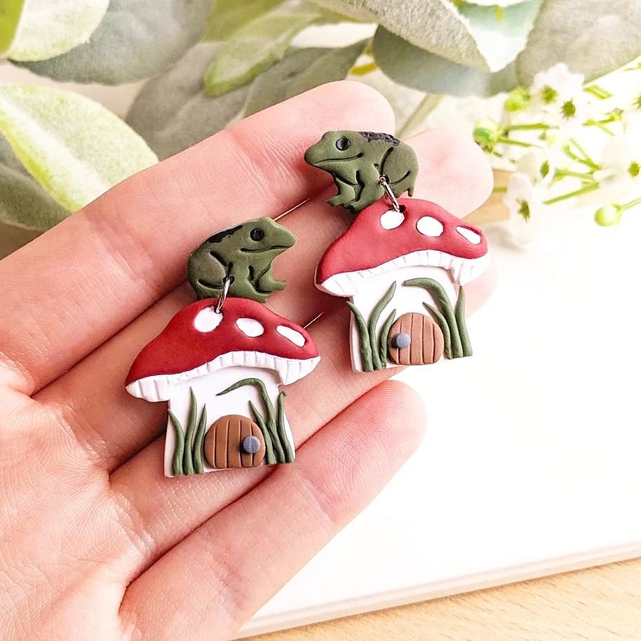 Restocked some of my favorite earrings today 🐸🍄
These by far are the most time consuming earrings I make but they're so worth it. Just look how cute they are. 🥹

Available online and at all of our upcoming events. ✨

#polymerclay #polymerclayearri