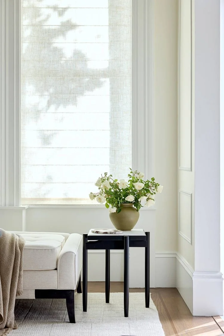 A cozy corner with a beige sofa