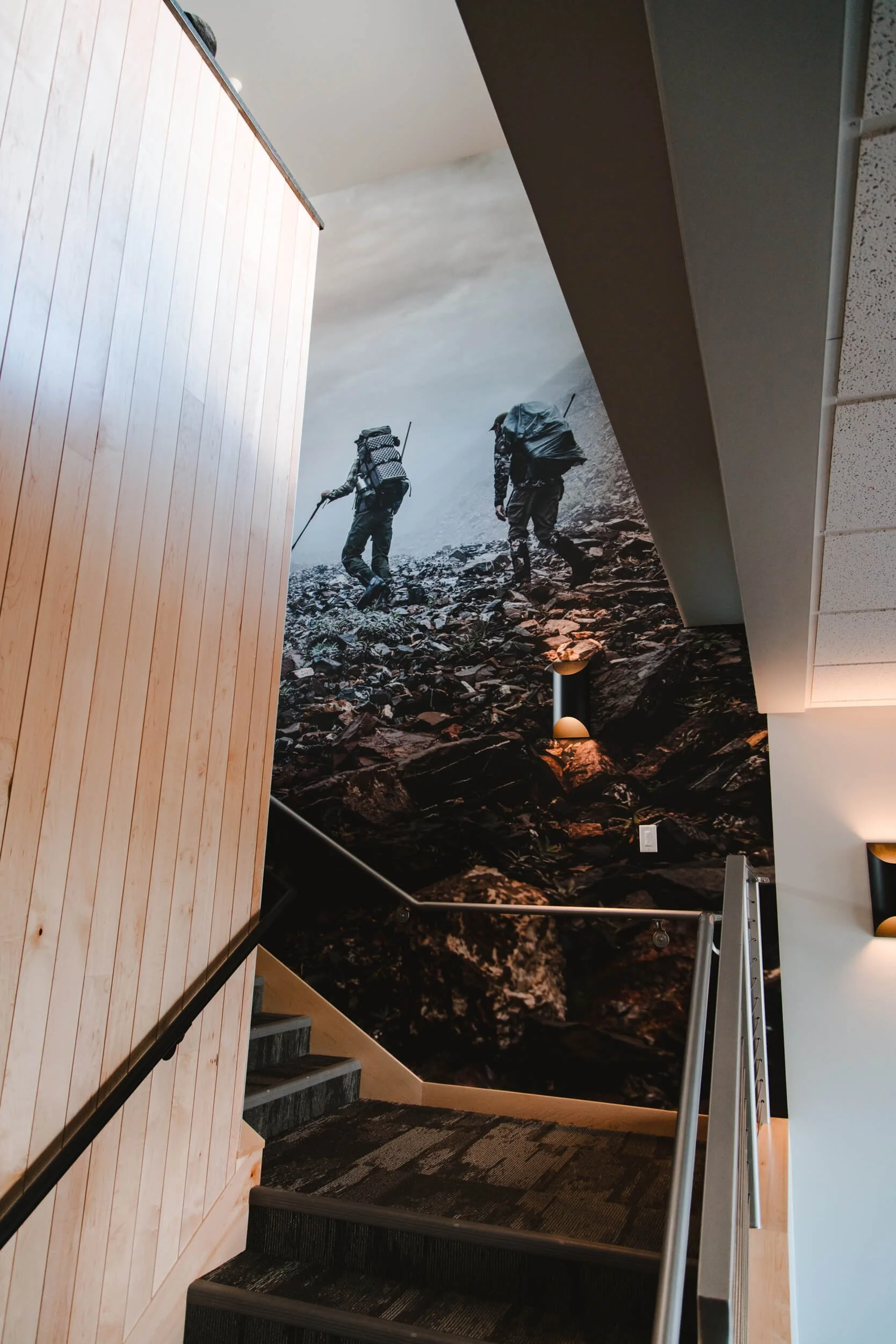 Branded hallway wall wrap with hikers by Wrap Agency for MeatEater in Bozeman, MT.