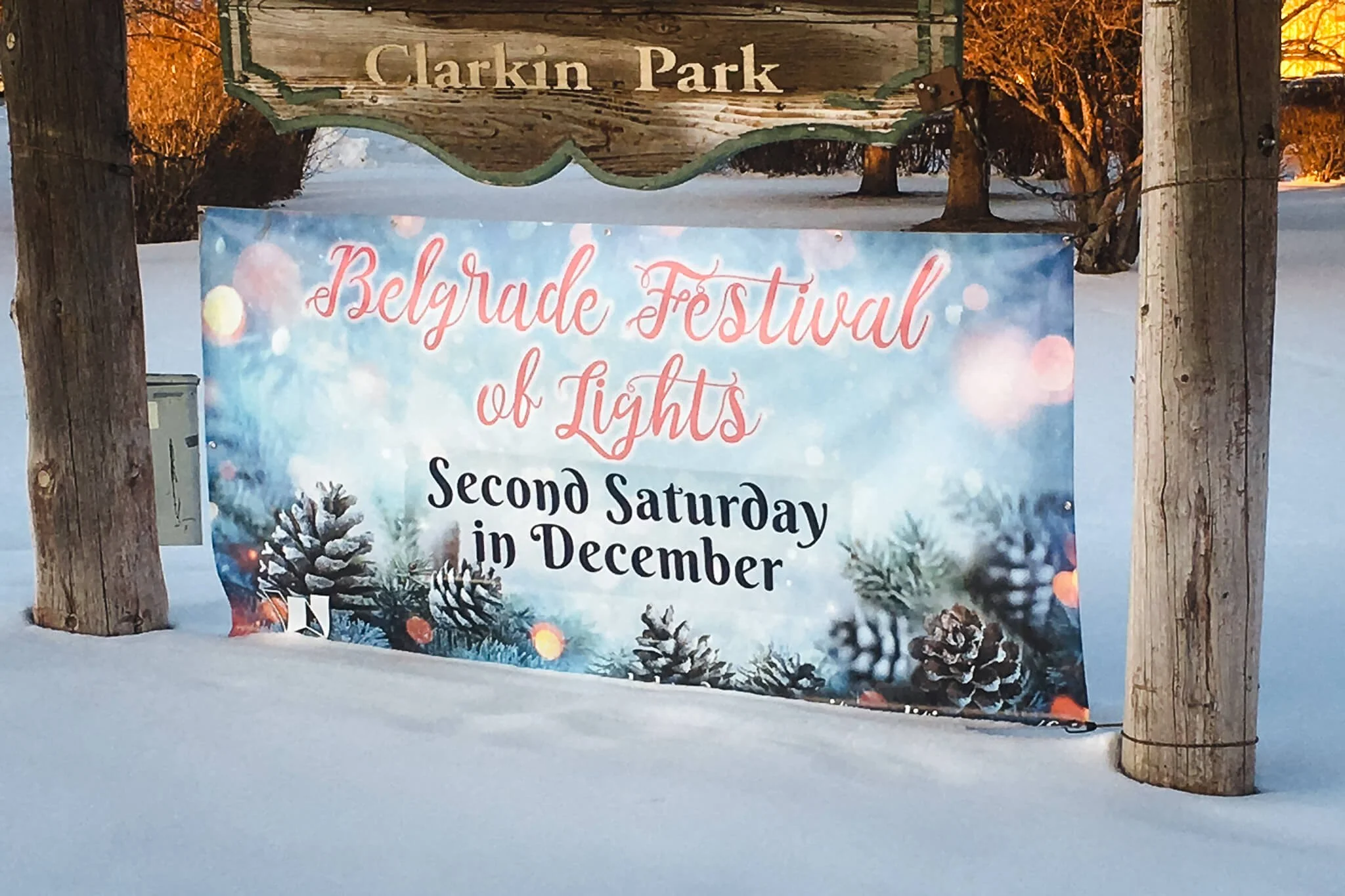 Seasonal event banner reading 'Belgrade Festival of Lights, Second Saturday in December' displayed at Clarkin Park.