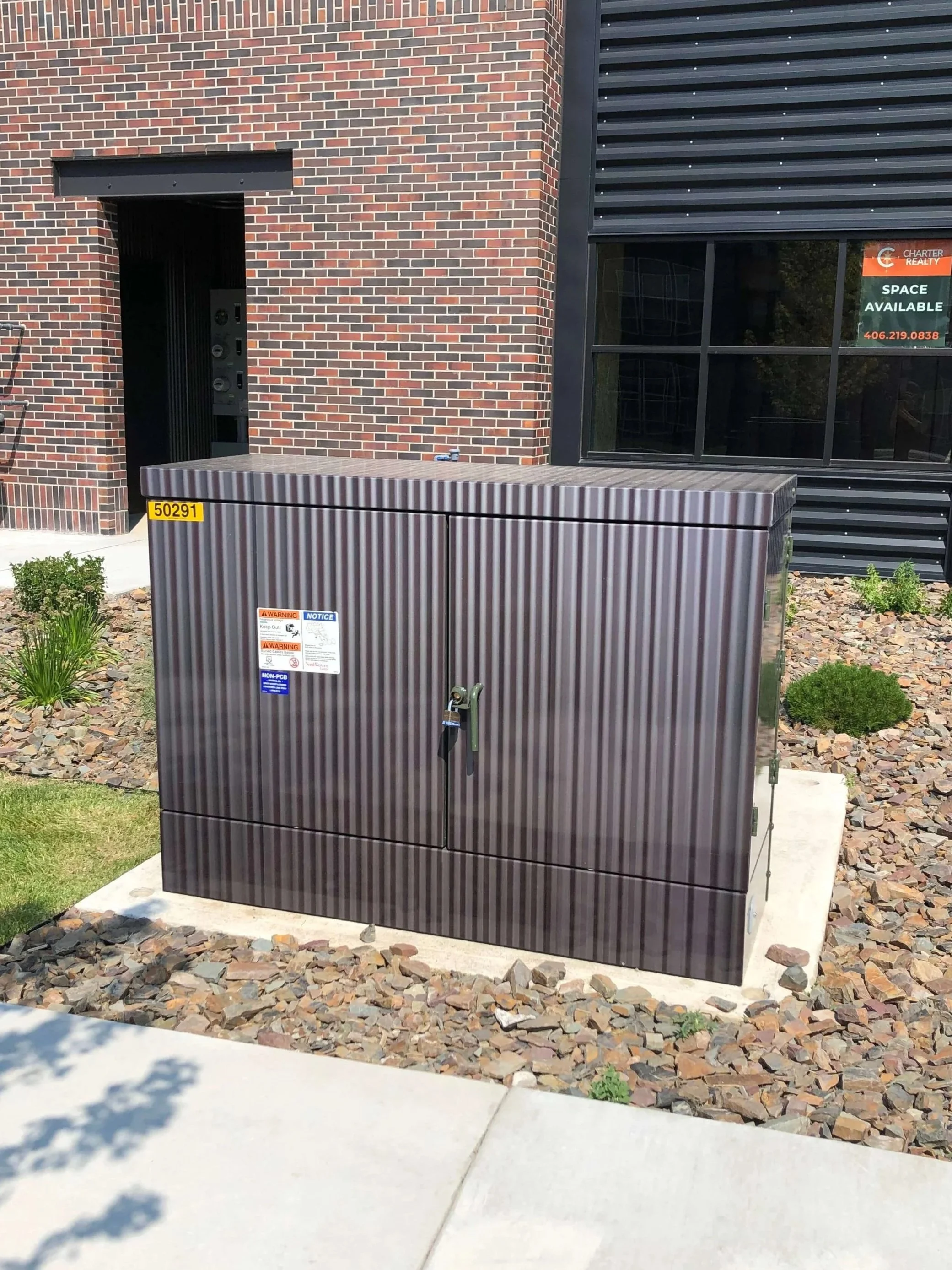Dark brown utility box with subtle, textured vinyl wrap to naturally blend into the surrounding area. 