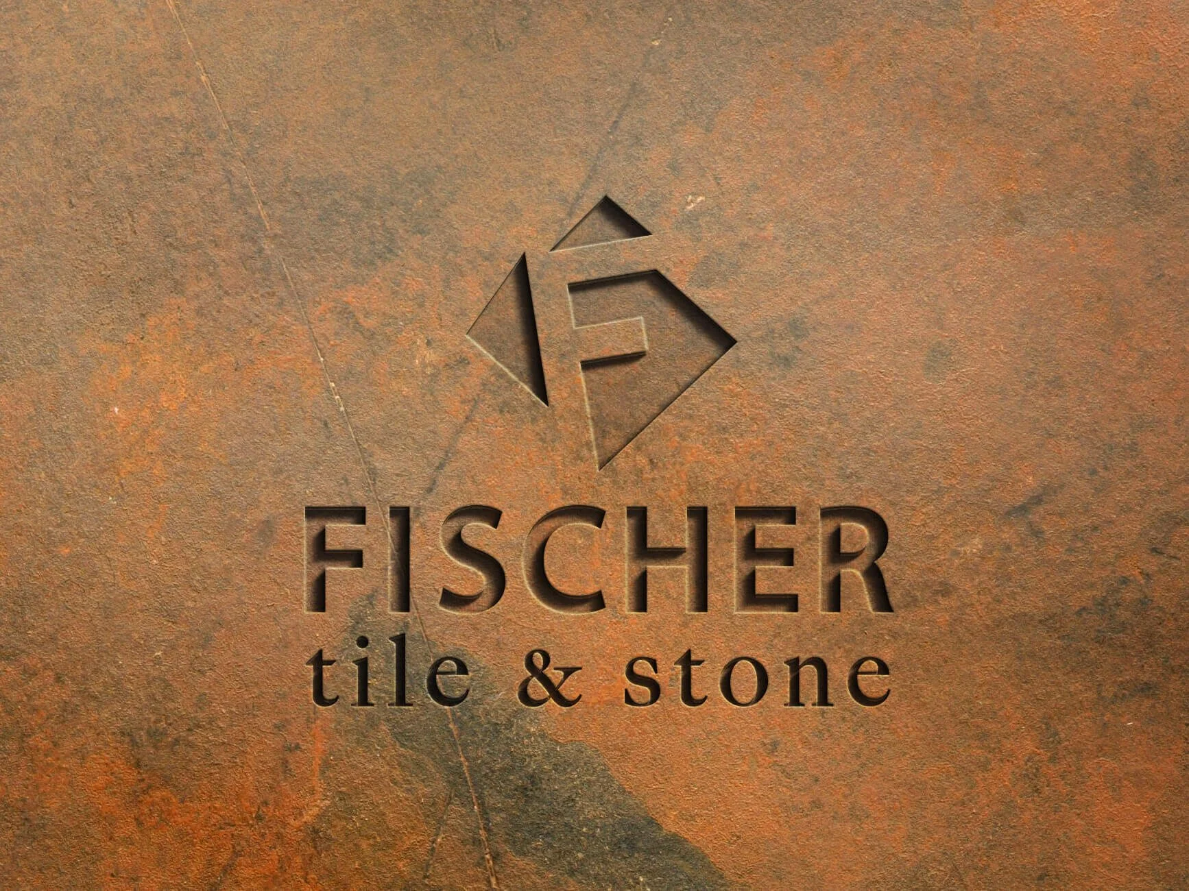 Fischer Tile & Stone logo on textured brown background with geometric design.
