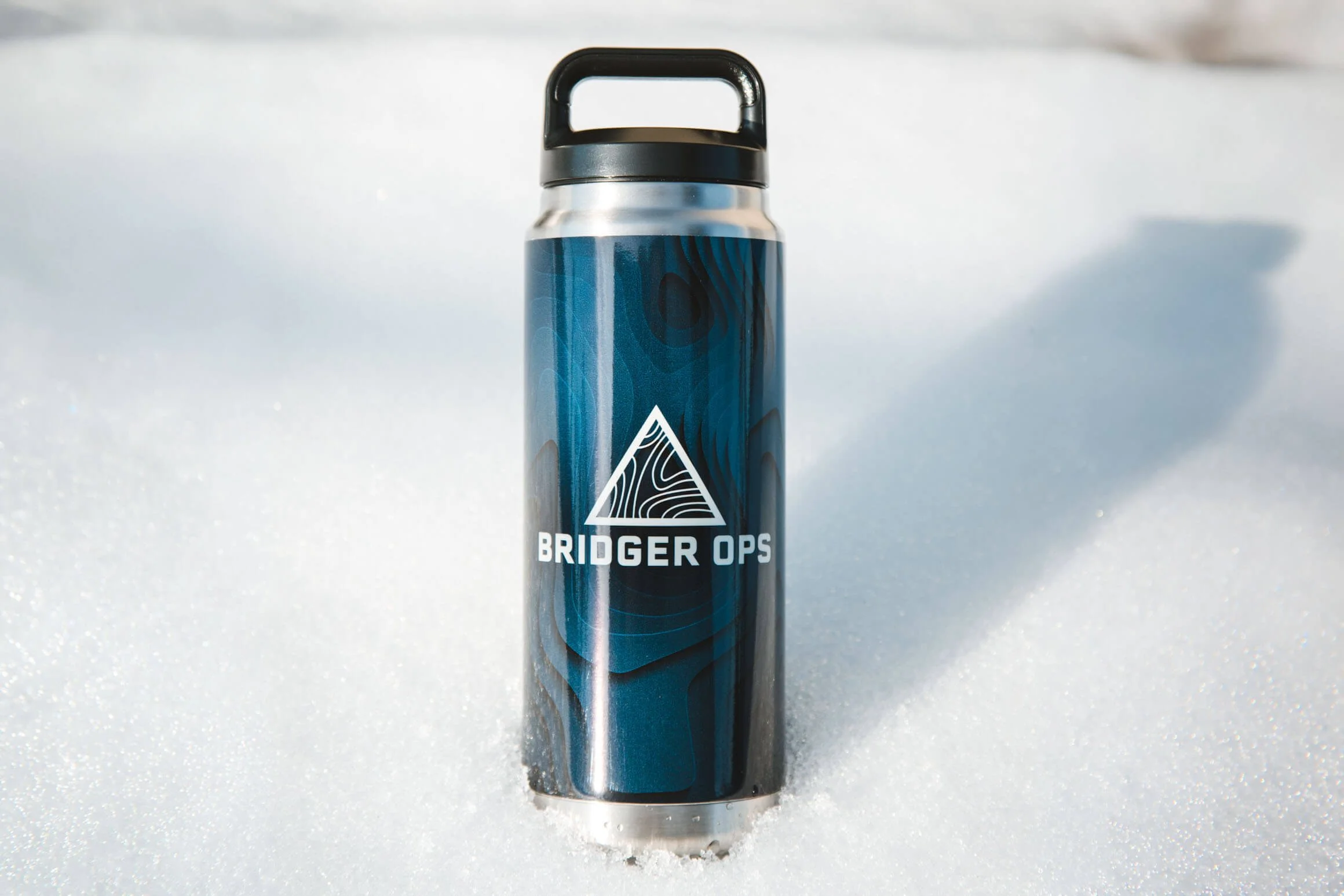YETI water bottle with gradient blue topo wrap with Bridger Ops logo
