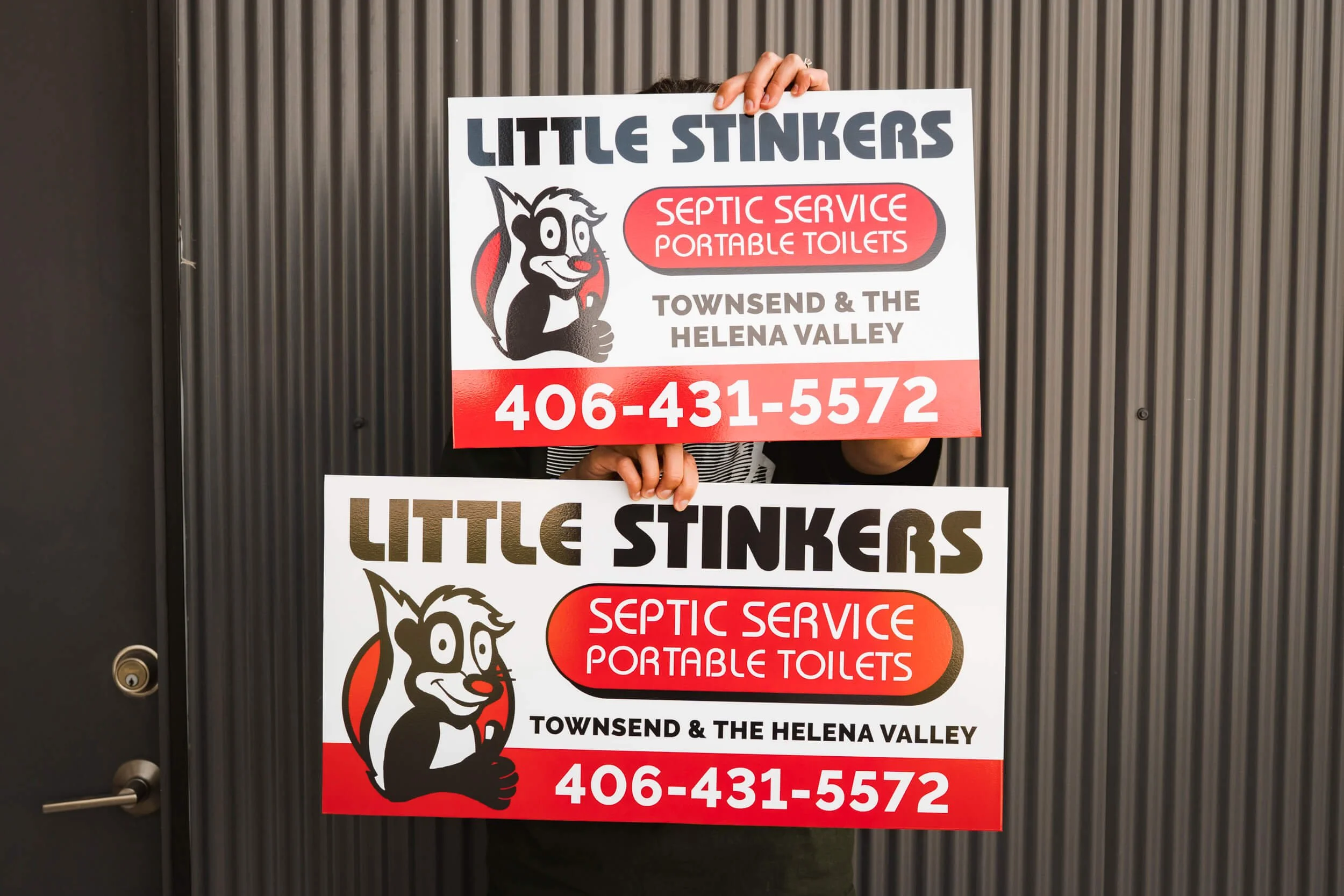 Bold red, black and white signage for Little Stinkers of Bozeman. Great example of conforming the same design across multiple sizes of dibond signs.