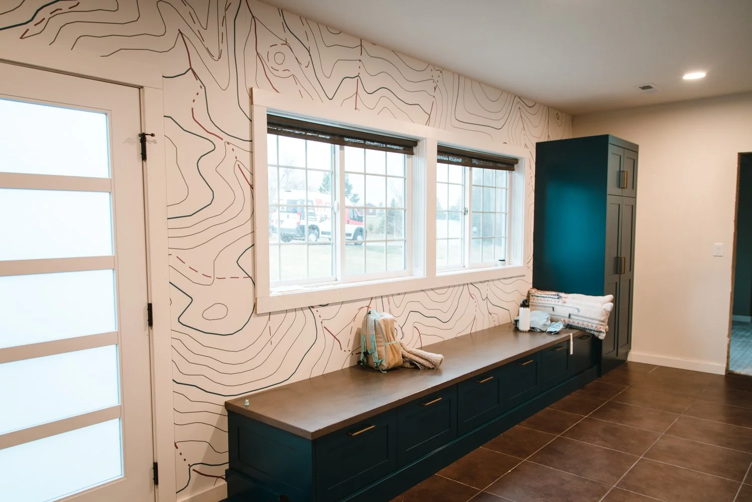 Entryway wall wrap of the Bridgers topographic map and hiking trails.
