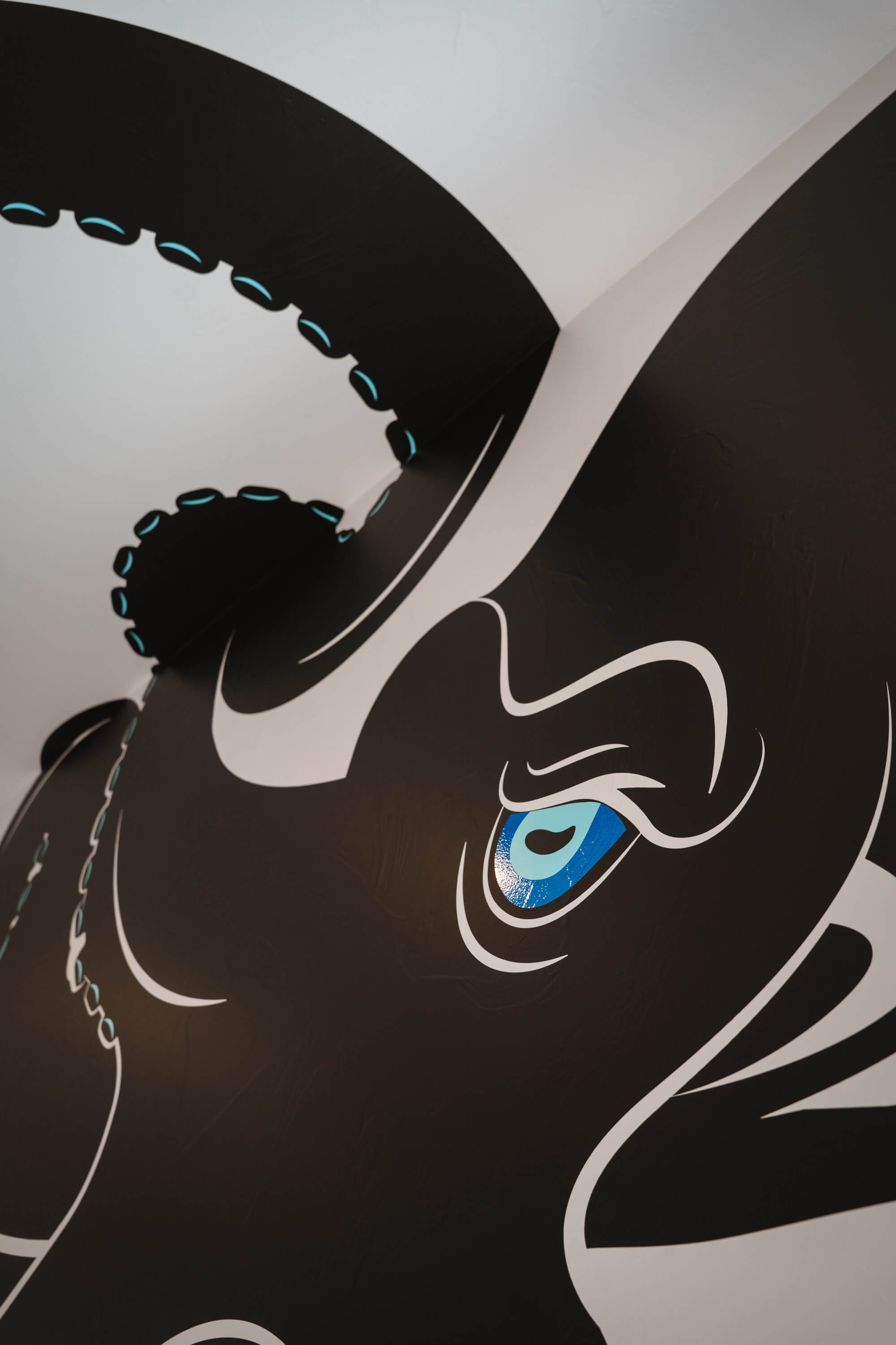 Detail view of the Kraken wall graphic showing the matte and gloss finishes used in the wall graphic