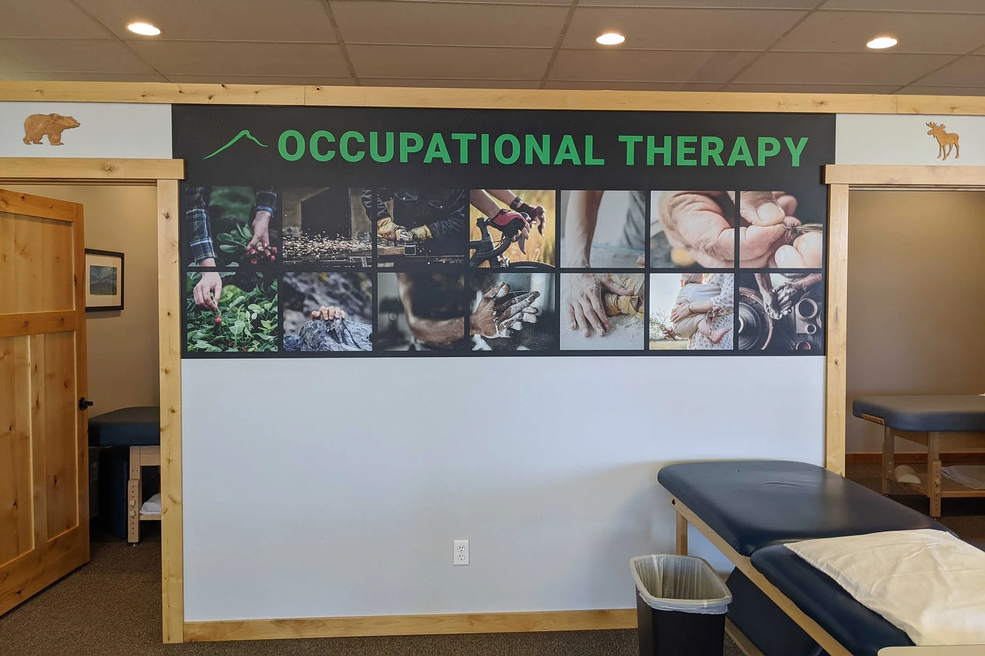 Wall wrap for an occupational therapy room featuring a collage of close-up photos showing hands engaged in activities like gardening, woodworking, and bike riding, with bold green "Occupational Therapy" text across the top.