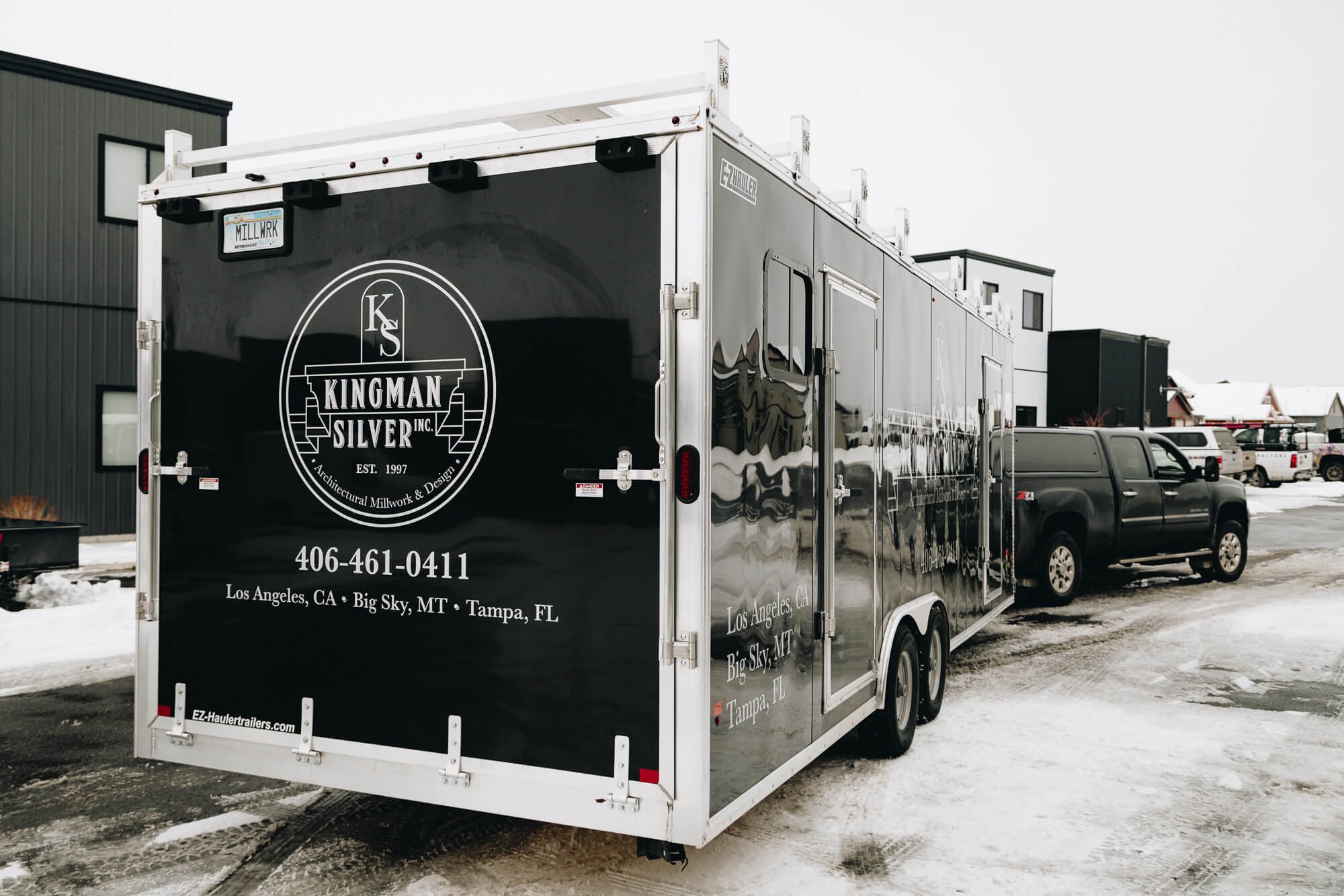 Kingman Silver trailer graphics in Bozeman, Montana, design on a black trailer with polished branding in white, featuring detailed logo, contact info, and multiple business locations.
