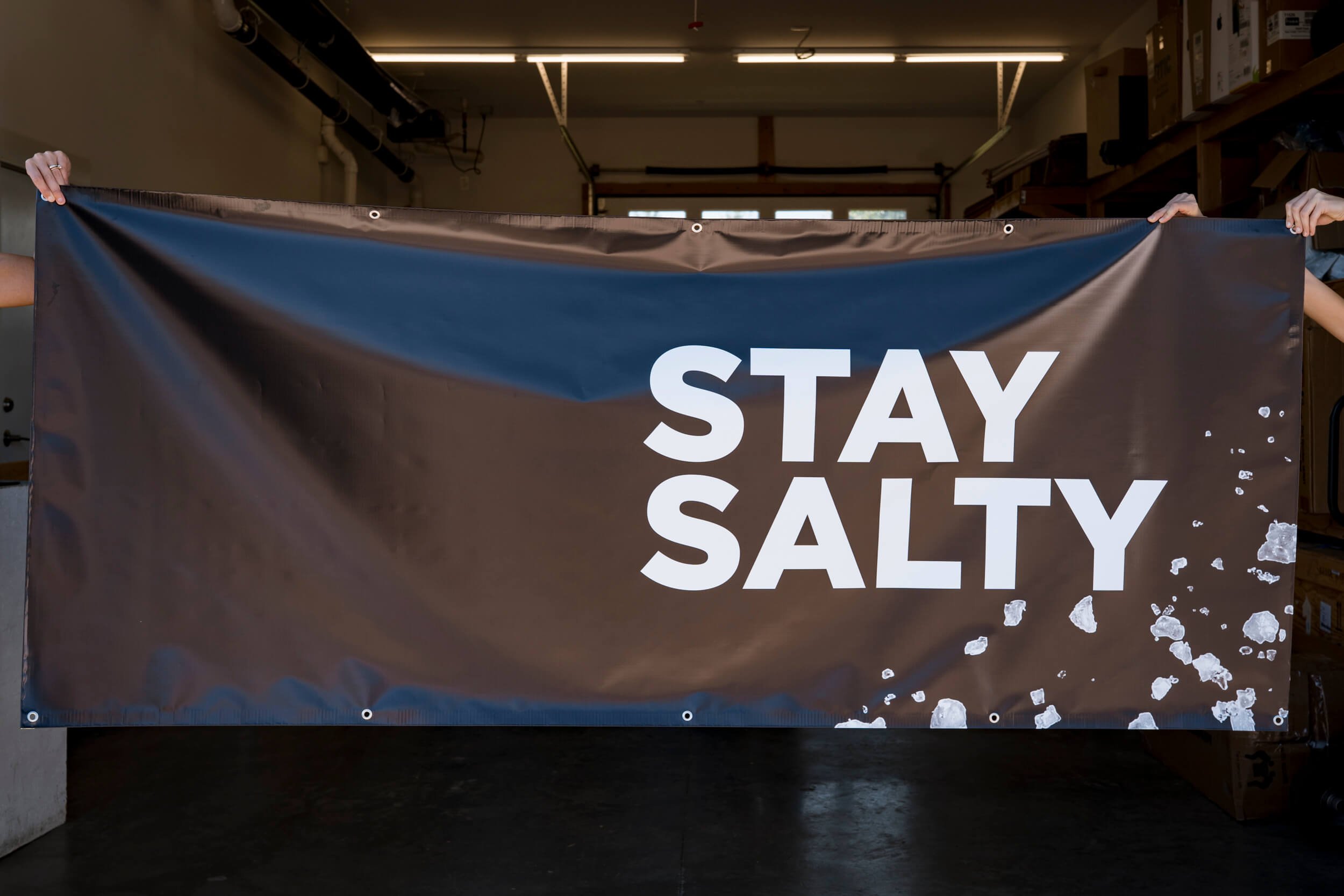Large white Stay Salty text on a black banner for LMNT