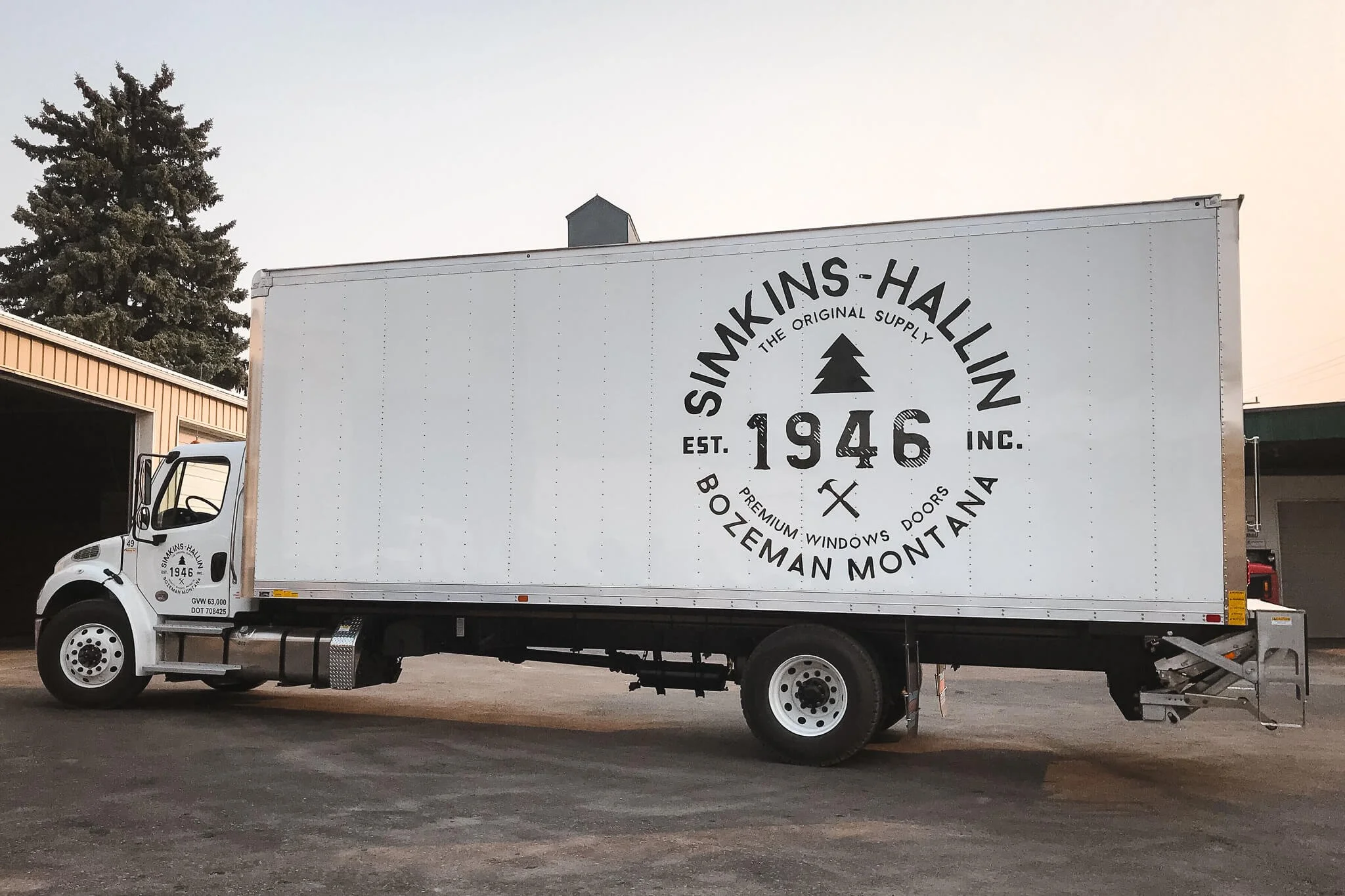 Simkins-Hallin box truck wrapped in a clean black and white logo design promoting premium building supply branding through professional fleet vehicle wraps in Bozeman, Montana.