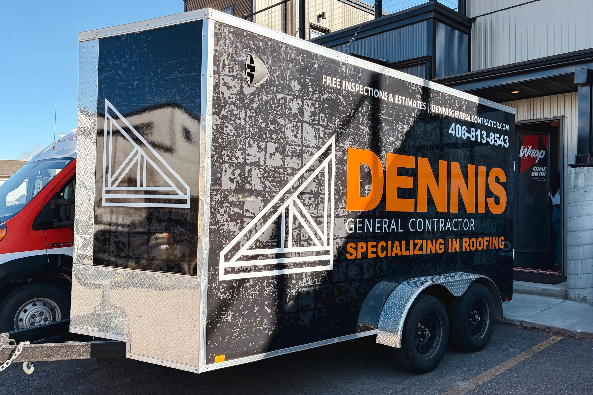 Grunge textured black background trailer wrap with large white and orange branding for Dennis General Contractor
