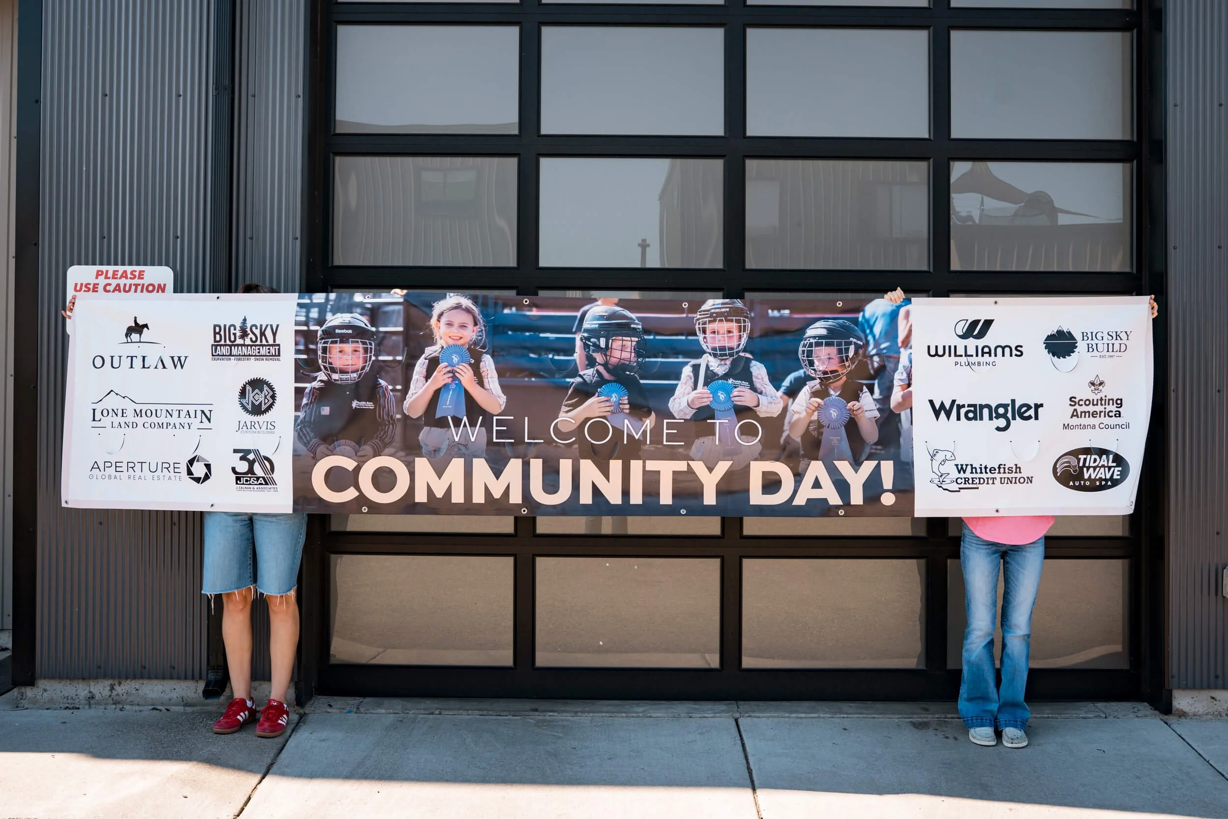 Extra large banner featuring a photo of Mutton Busting kids and sponsor logos, promoting Big Sky PBR's Community Day