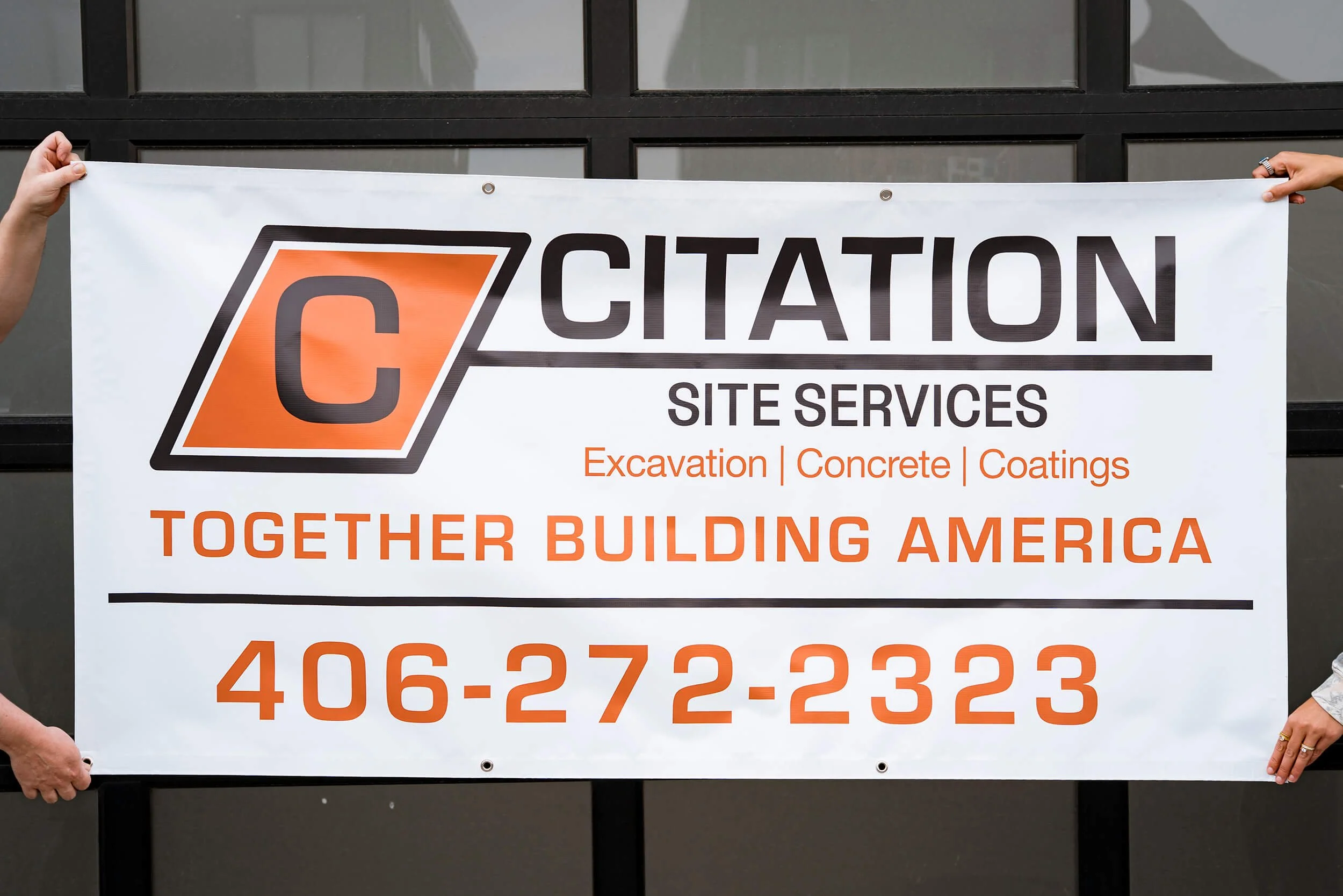White banner with large black and orange logo and text promoting Citation Site Services