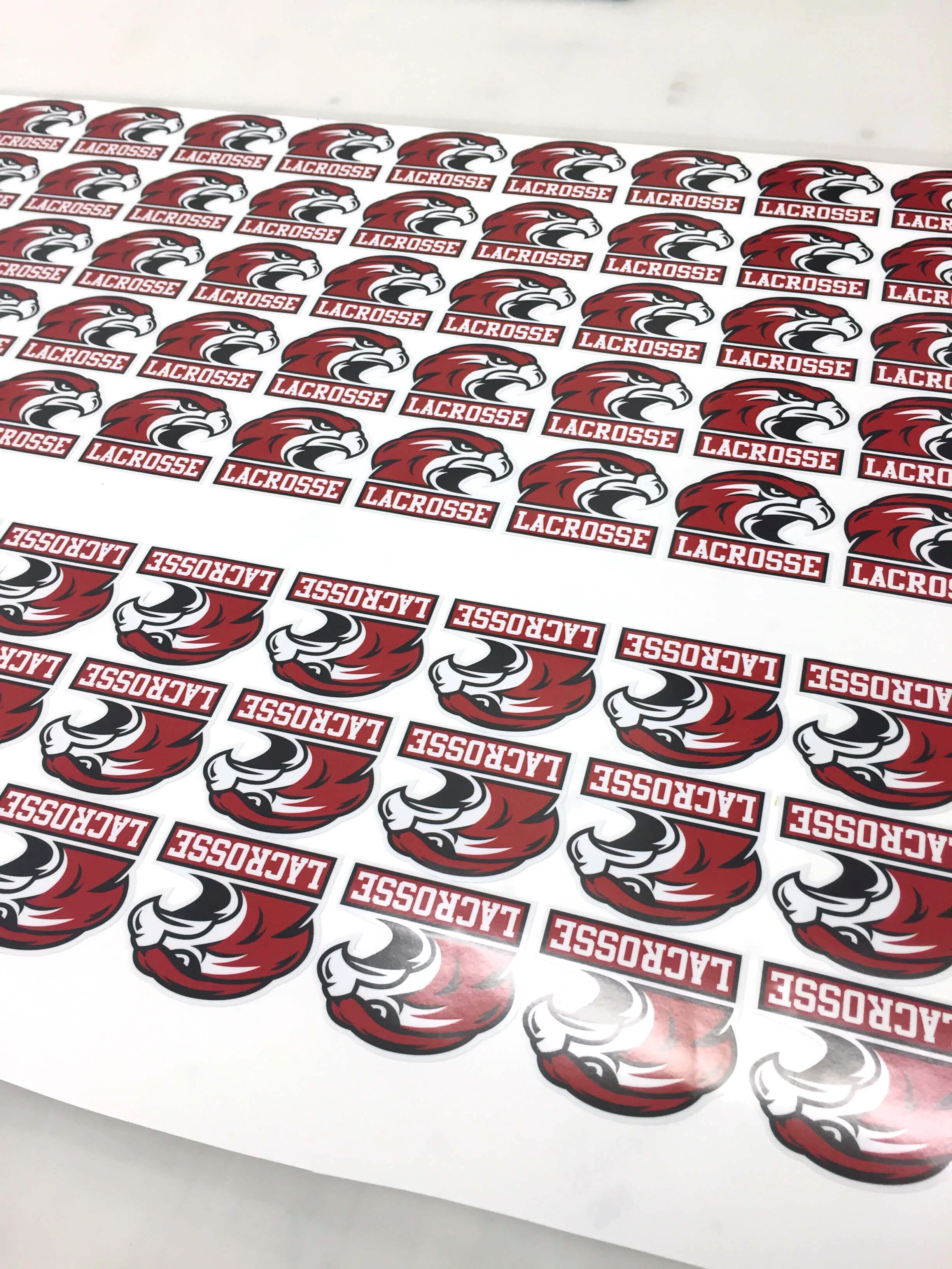 Die-cut sticker sheets printed in bulk for Bozeman Hawks Lacrosse.