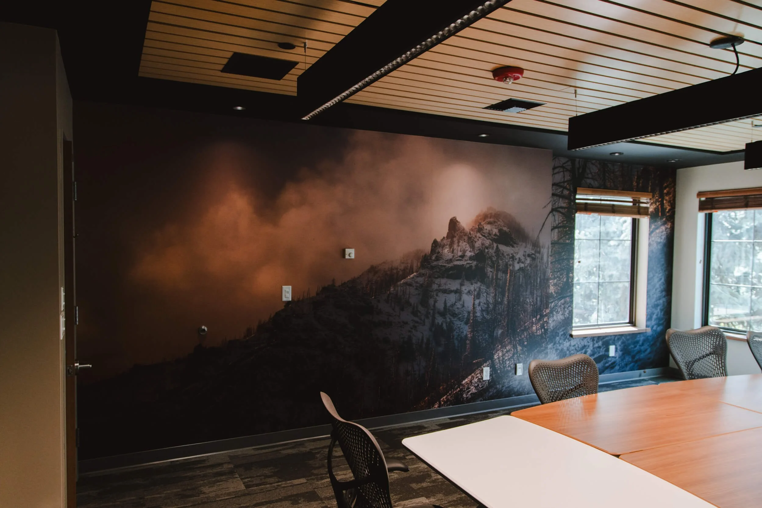 Dramatic mountain peak wall wrap by Wrap Agency for MeatEater in Bozeman, MT.