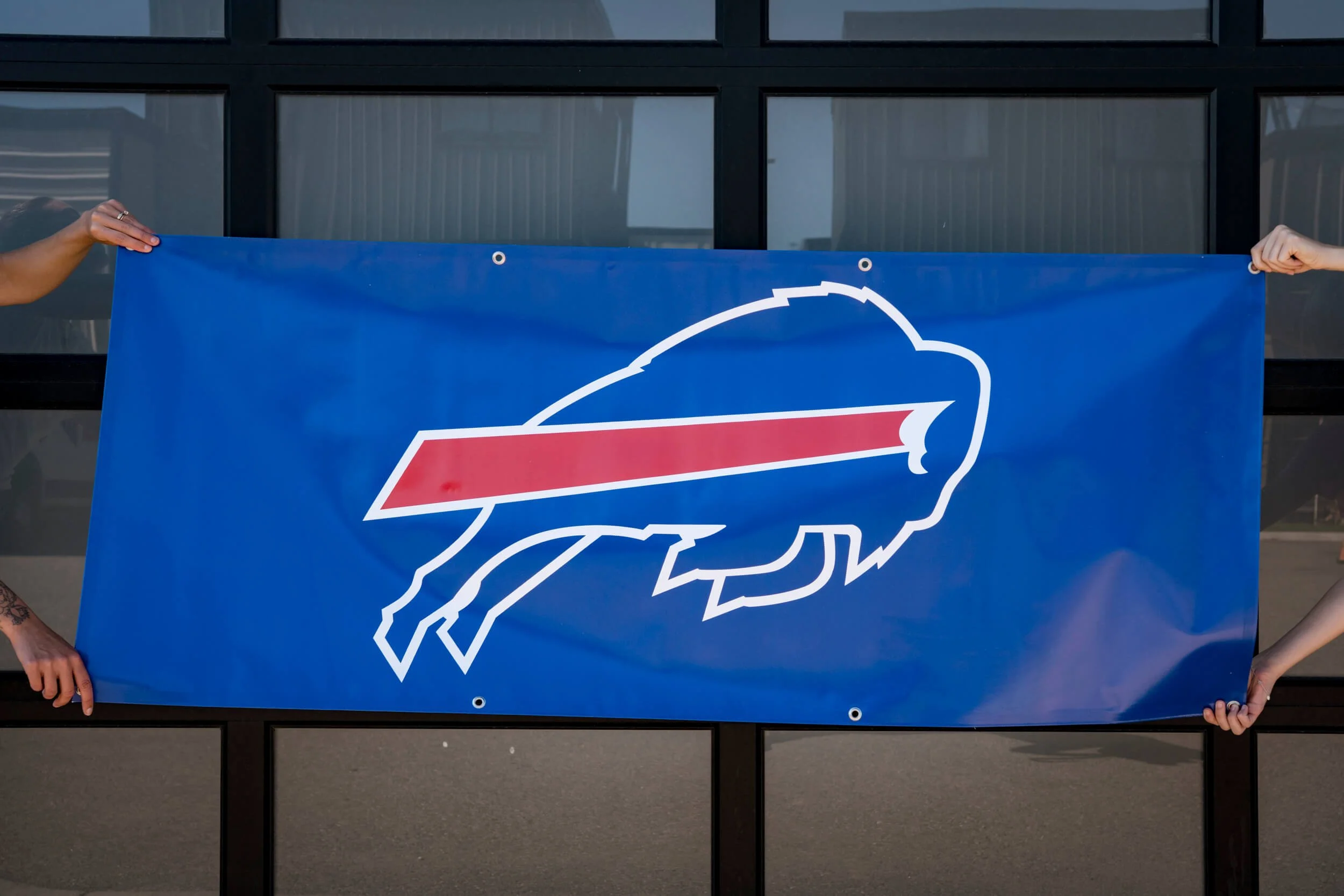 Sponsor banner with a large Buffalo Bills logo and bright blue background