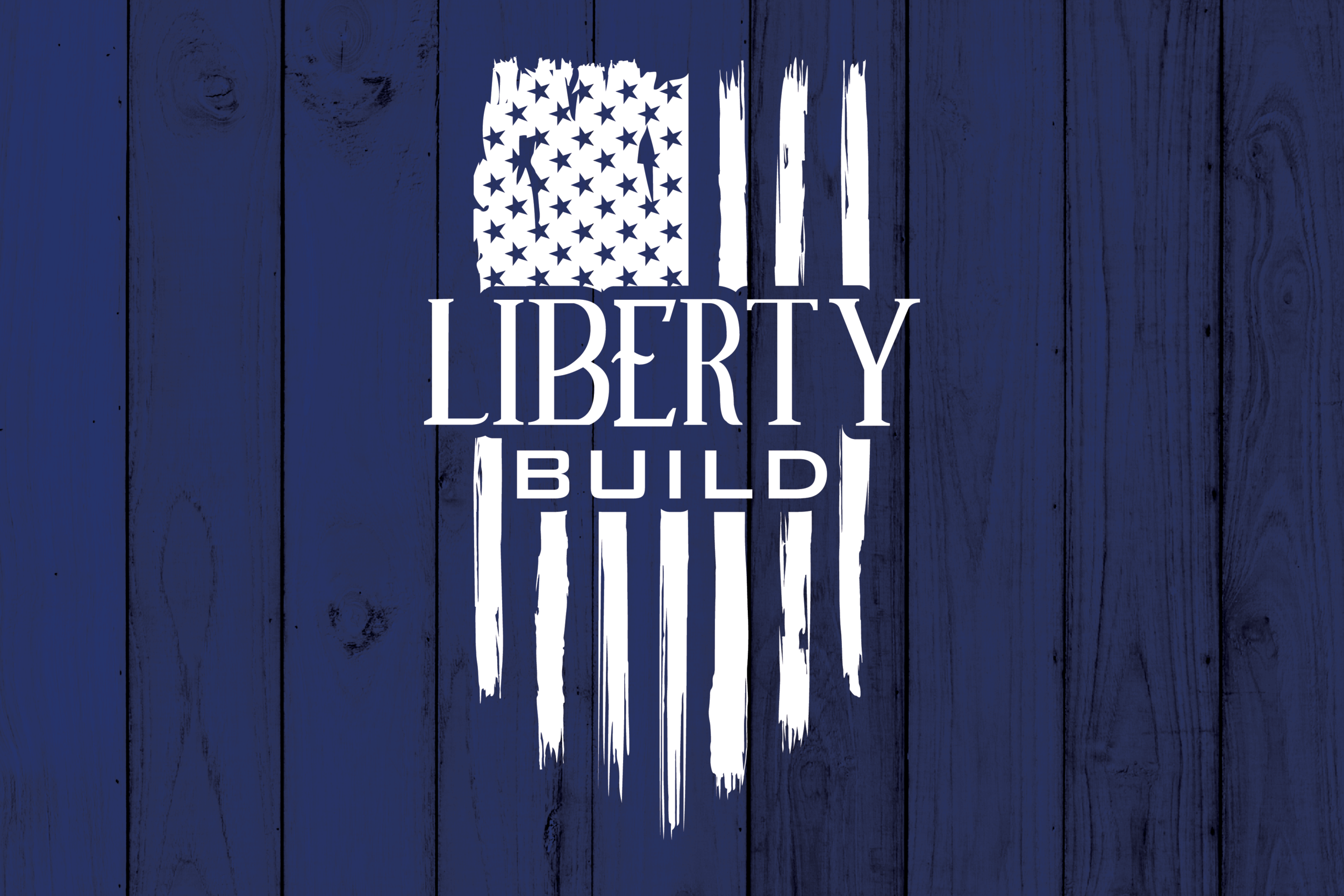 Liberty Build logo with American flag design on a blue wooden background.