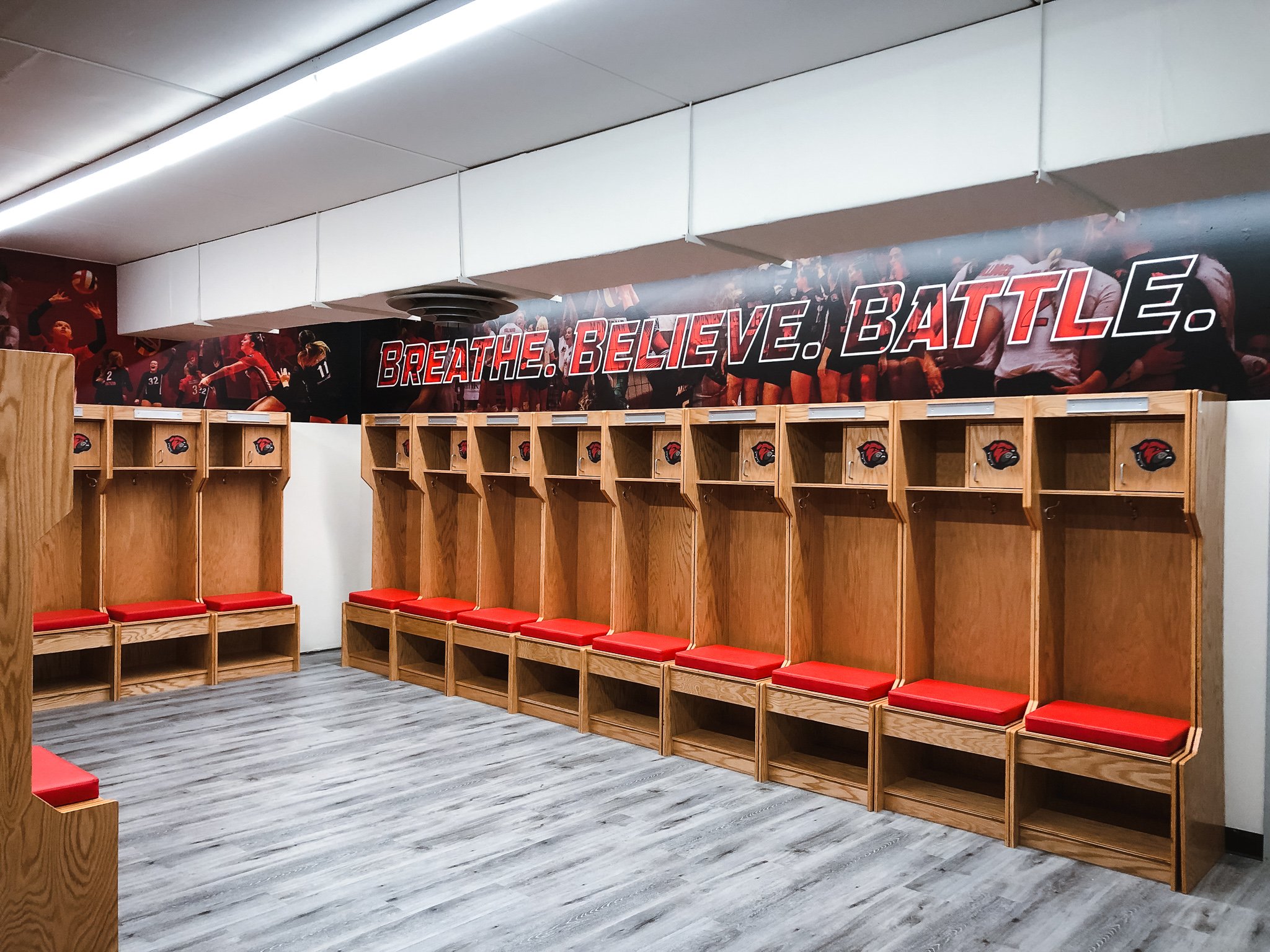 Montana Western Women's Volleyball locker room wall wrap with Breath. Believe. Battle text on photo composite background.