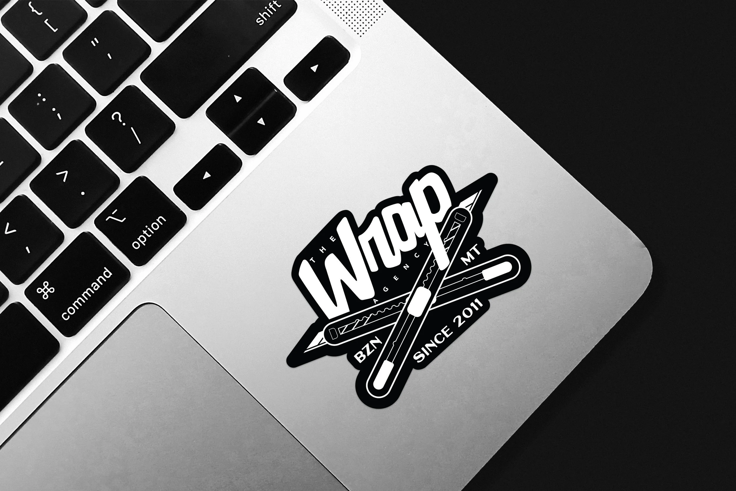 The Wrap Agency sticker on a laptop