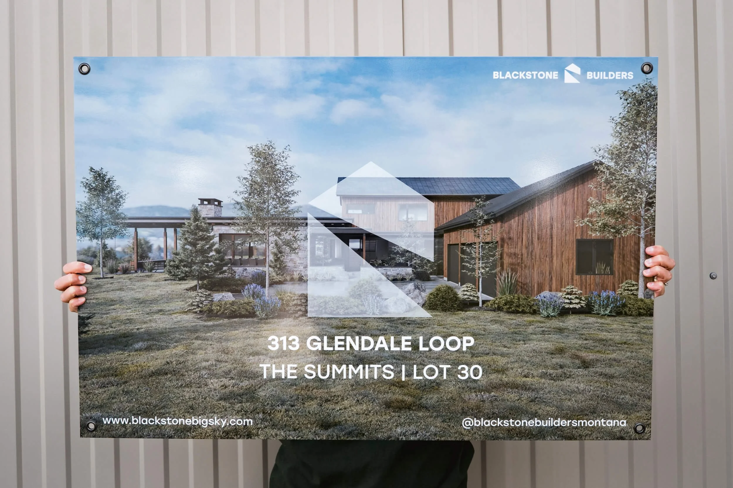 Residential building marketing sign featuring a full bleed rendering of the home with natural landscape and mountains in the background. Custom dibond sign for a Bozeman building company