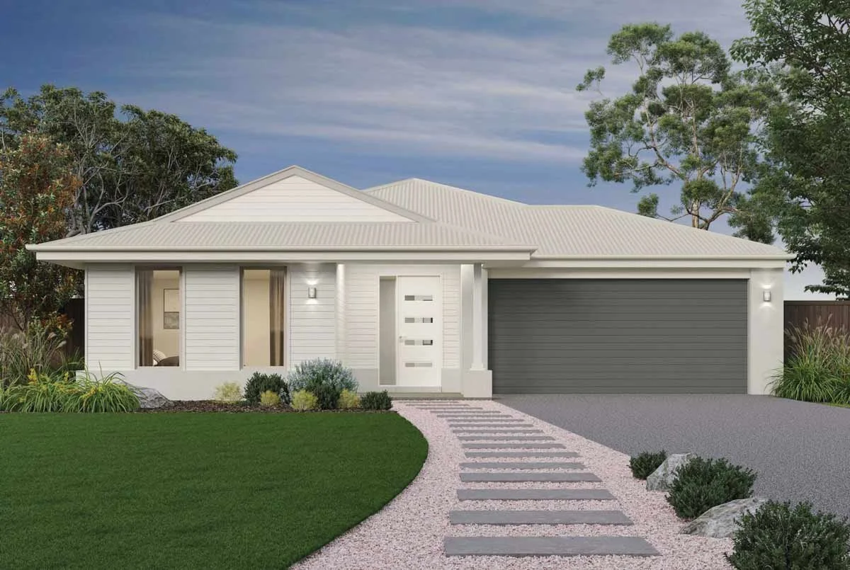 Front view of a modern white house with a gray garage door, a small front yard with grass and landscaping, and a pebble pathway leading to the front door, with trees and a partly cloudy sky in the background. In the Elloura Estate, Nagambie.