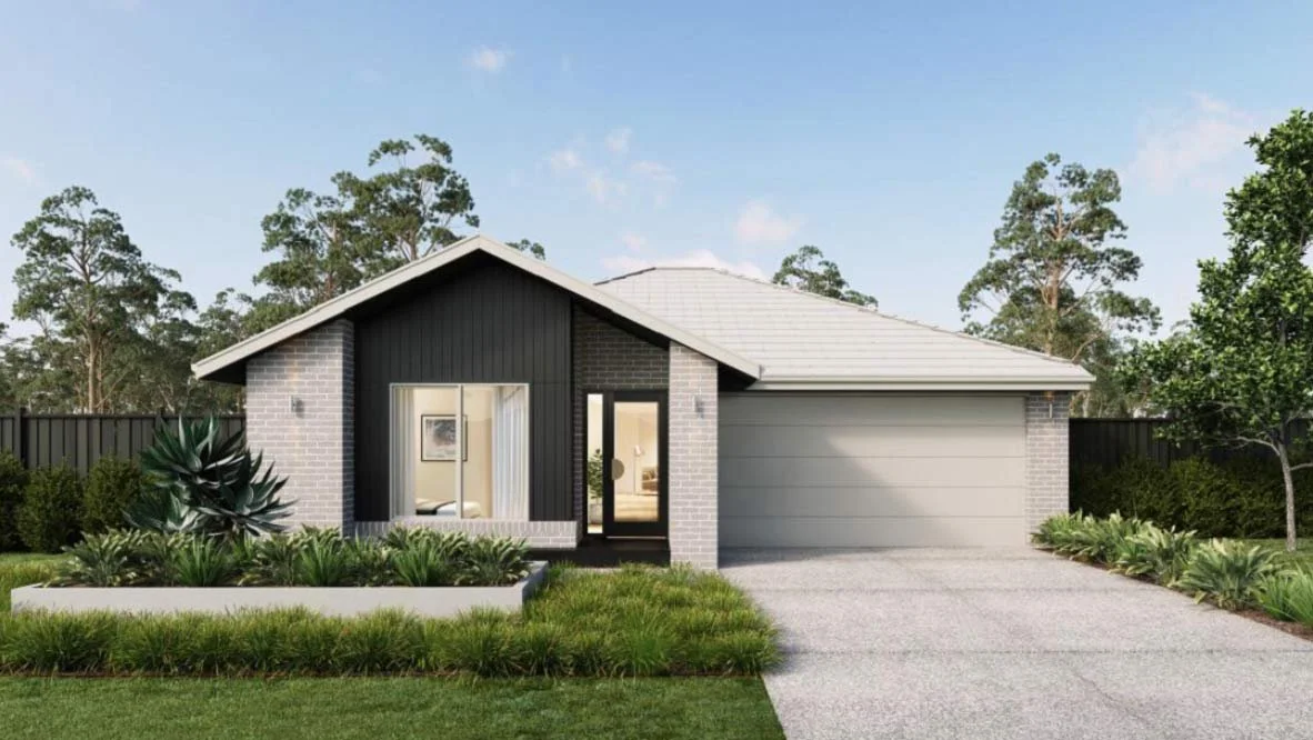 Modern house with a gray brick and black wood front, large window, and garage, surrounded by green lawn and trees. Within the Elloura Estate, Nagambie. House is built by Metricon Homes.