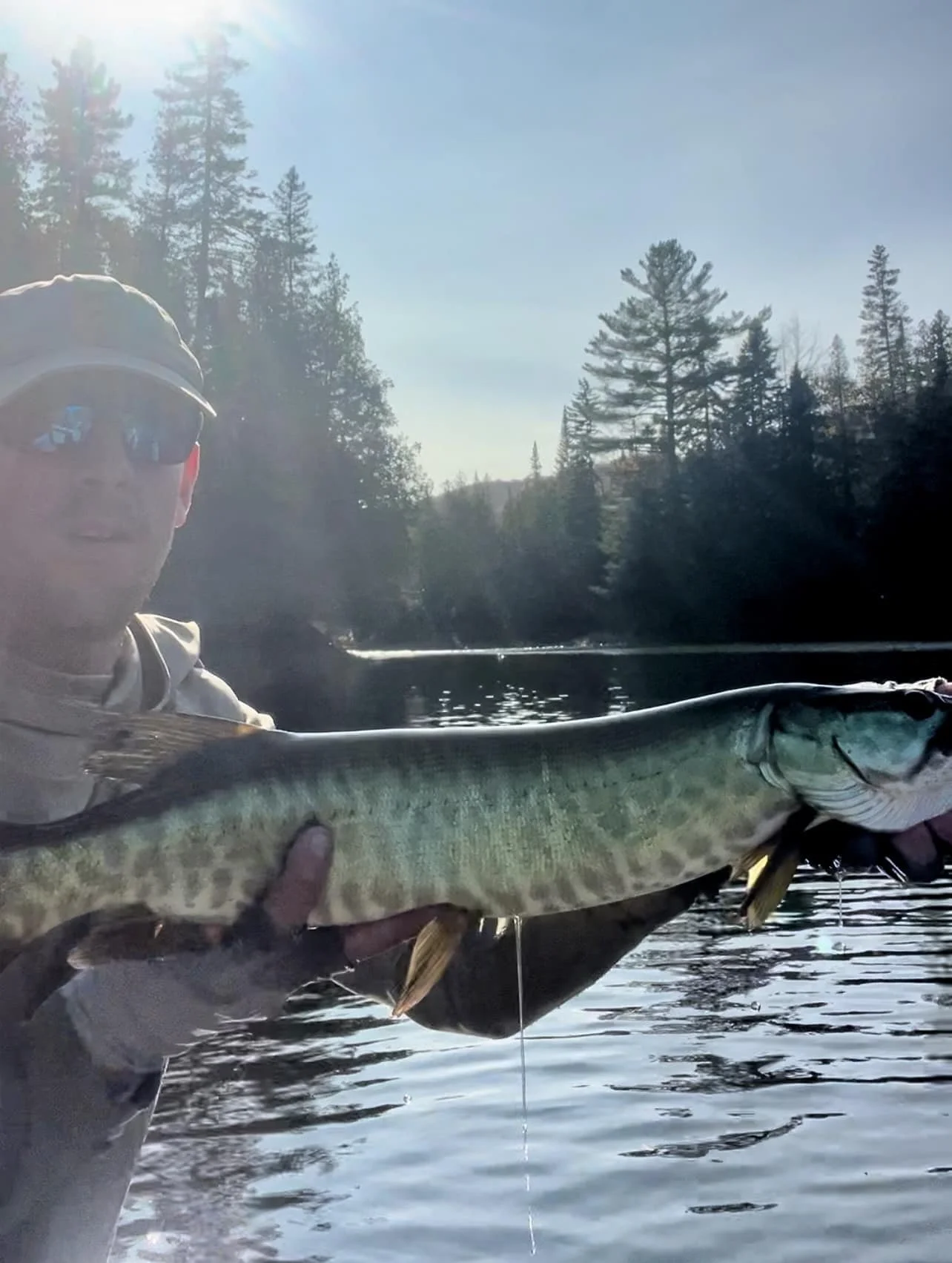 Maine Fishing Guide Brandon Bichrest with a Musky caught on a Fly in Maine