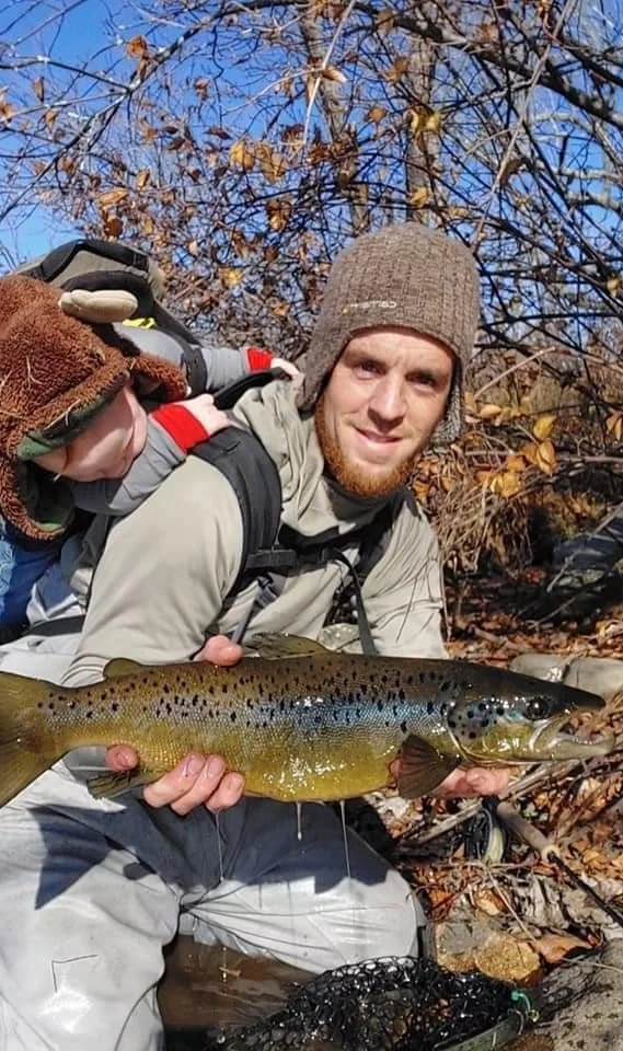 Maine Fishing Guide Brandon Bichrest and two year old son Oliver Bichrest with a 23" Landlocked salmon caught on a fly in November in Maine