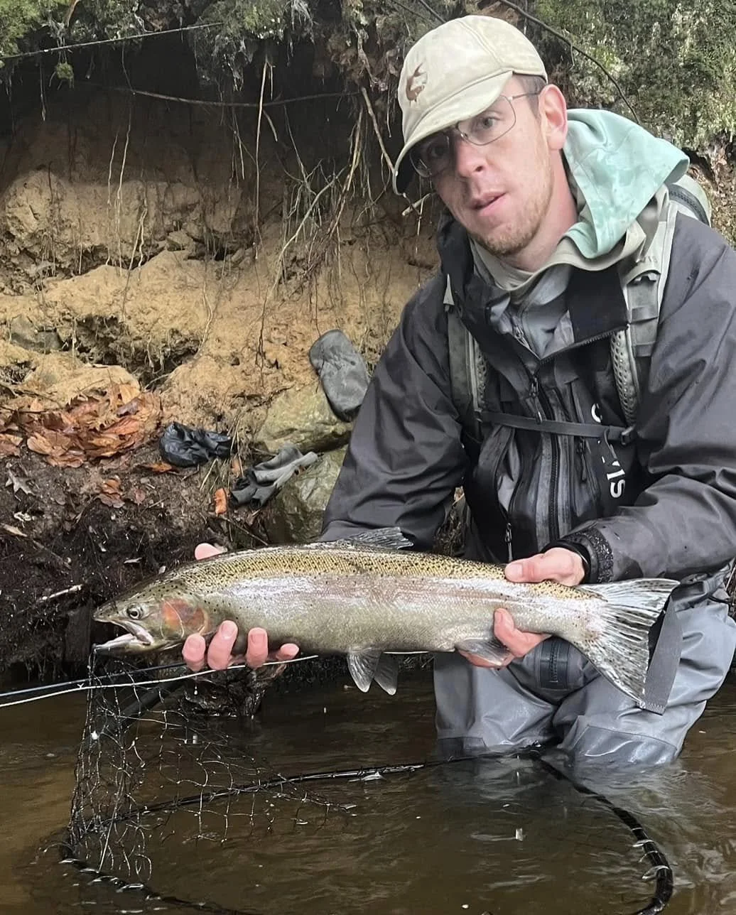 Maine Fishing Guide Brandon Bichrest with a Steal head Trout on a fly in New York